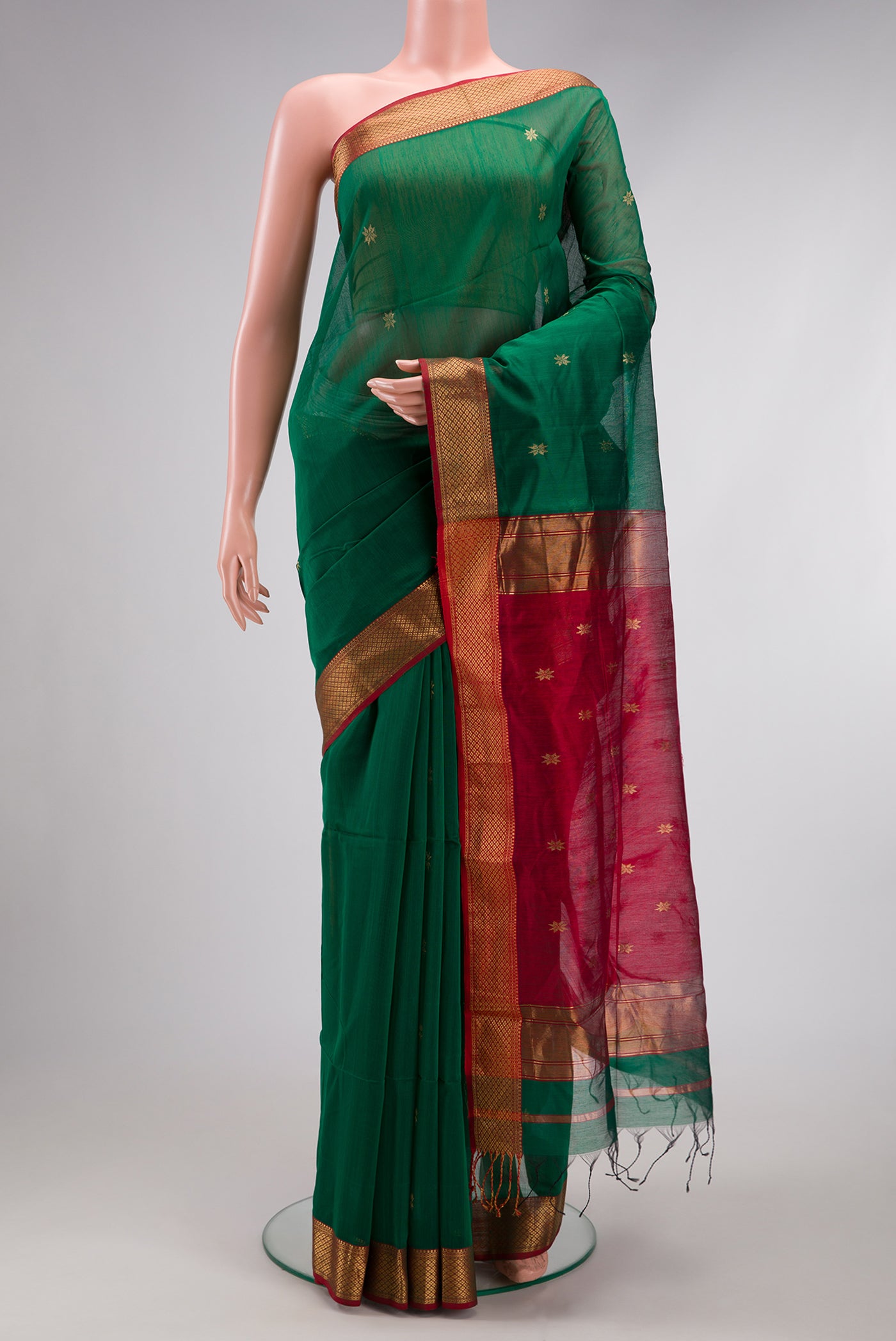 Green Dual Tone Maheshwari Silk Cotton Saree with Zari Butta on the body and Zari Border.  displayed on a mannequin