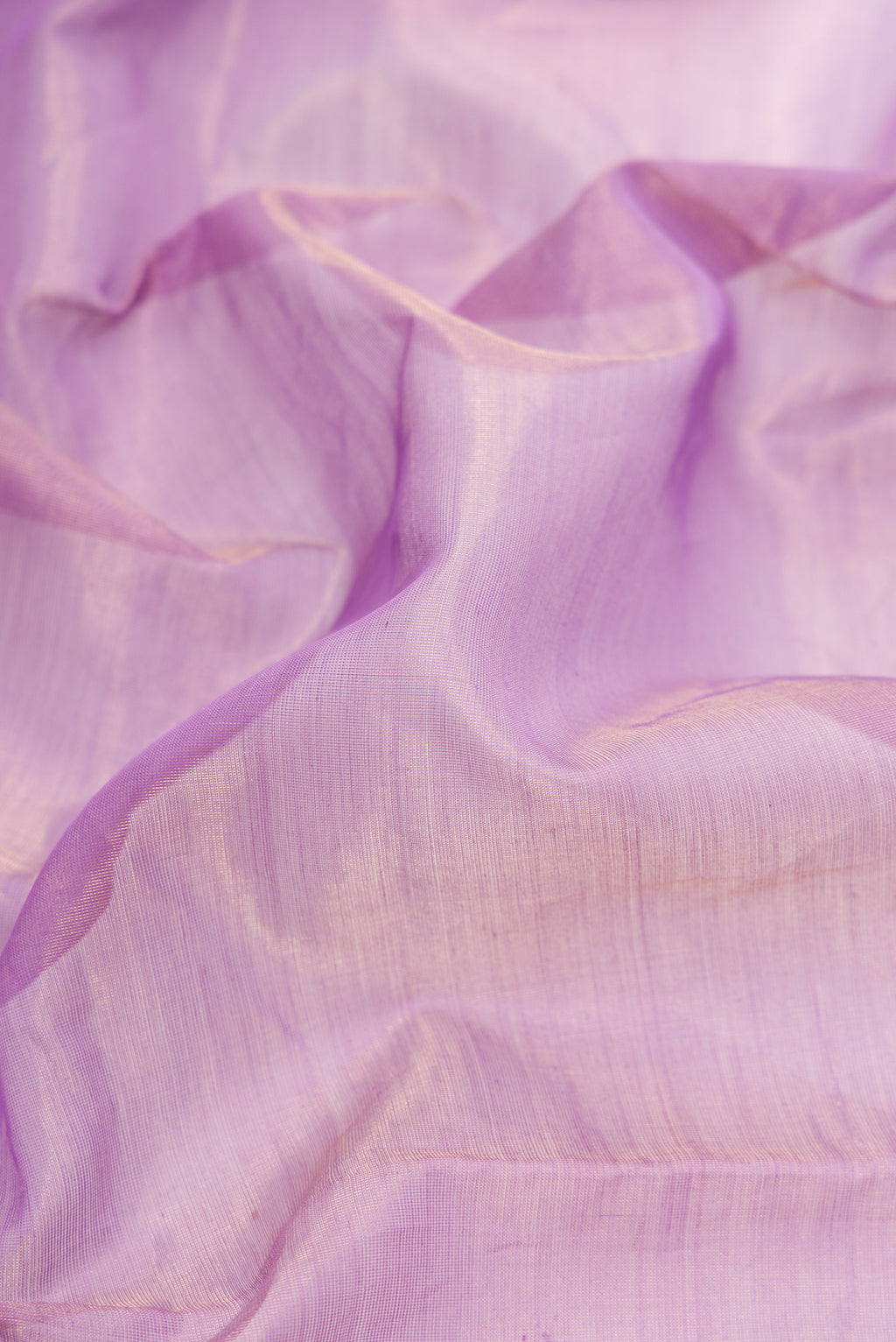 Close up of Lavender Dual Tone Maheshwari Tissue Silk Saree with Plain Body and Zari Border.  displaying folds