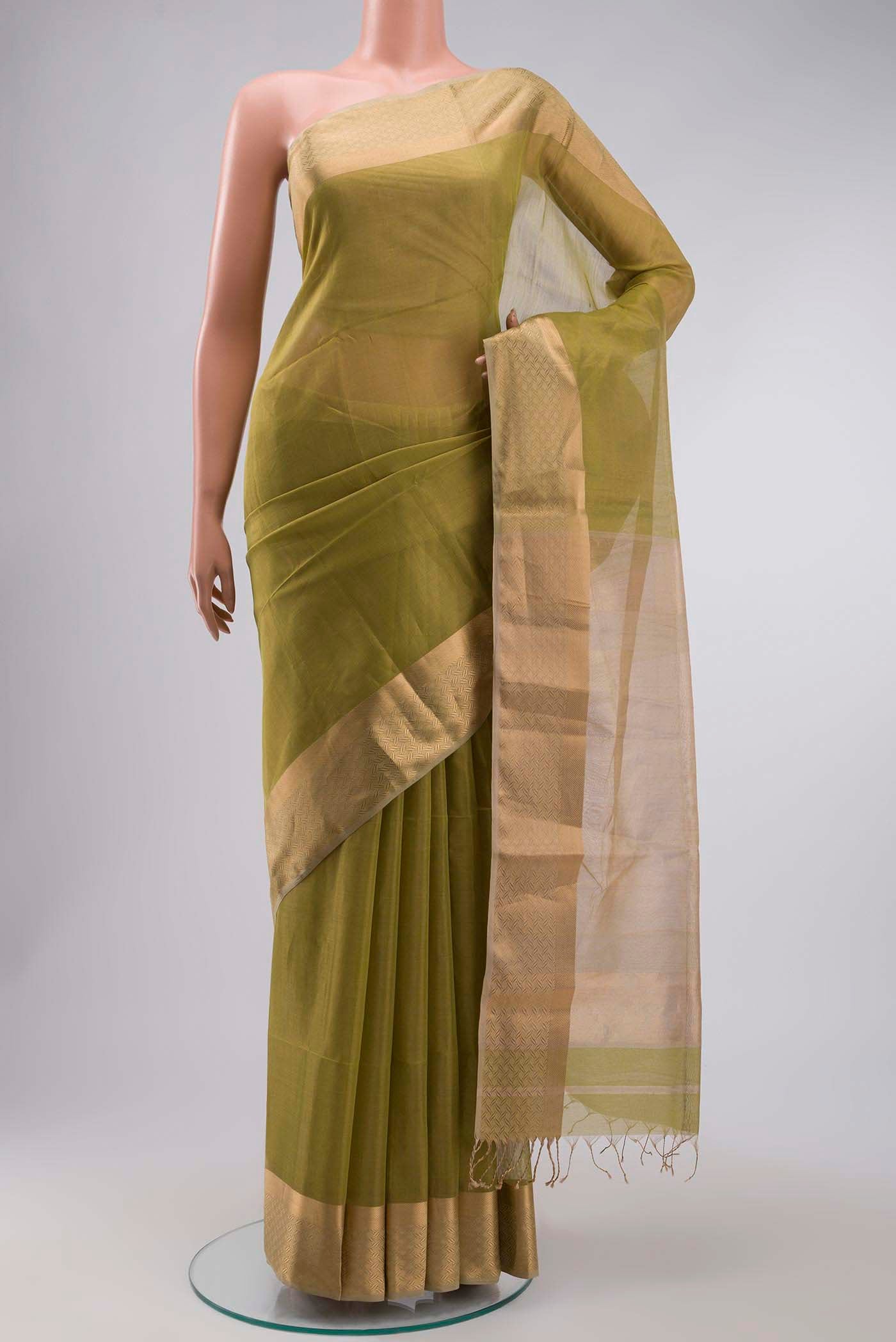 Green Maheshwari Silk Saree with Plain Body and Zari Border displayed on a mannequin