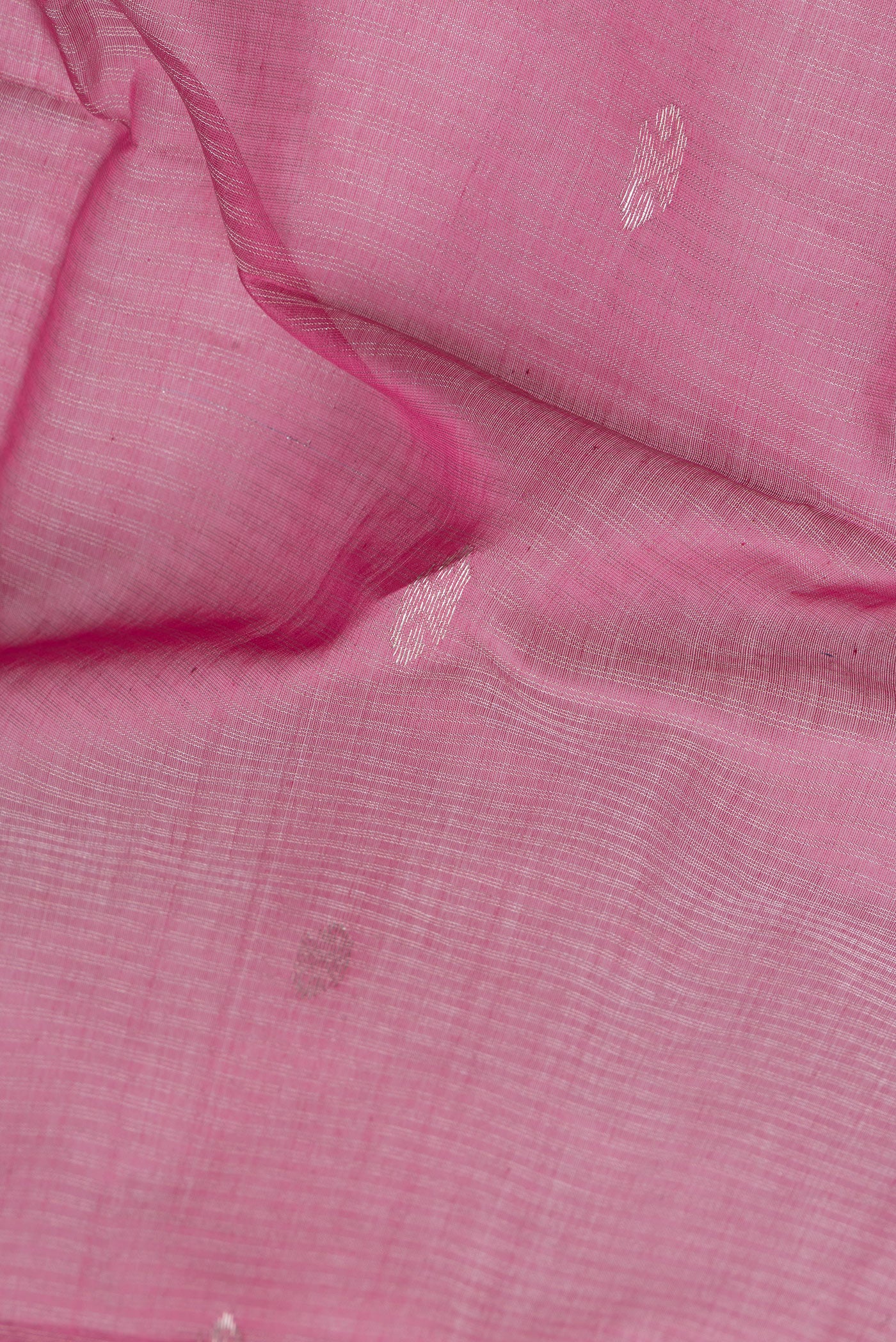 Close up of Pink Dual Tone Maheshwari Silk Saree with Stripes on the body and Zari Border.  displaying folds