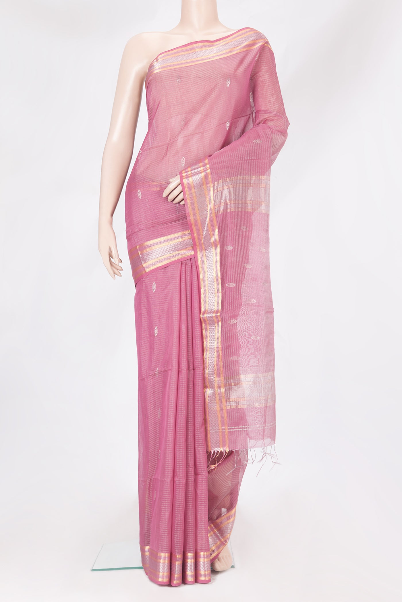 Pink Dual Tone Maheshwari Silk Saree with Stripes on the body and Zari Border.  displayed on a mannequin