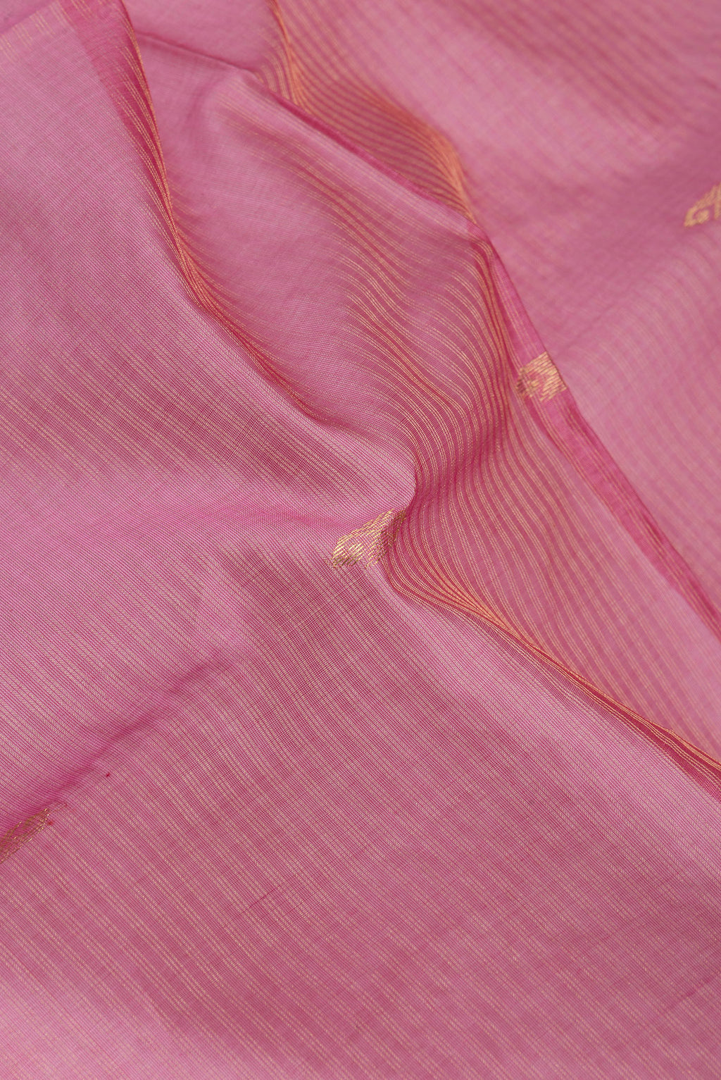 Close up of Pink Dual Tone Maheshwari Silk Saree with Stripes on the body and Zari Border.  displaying folds