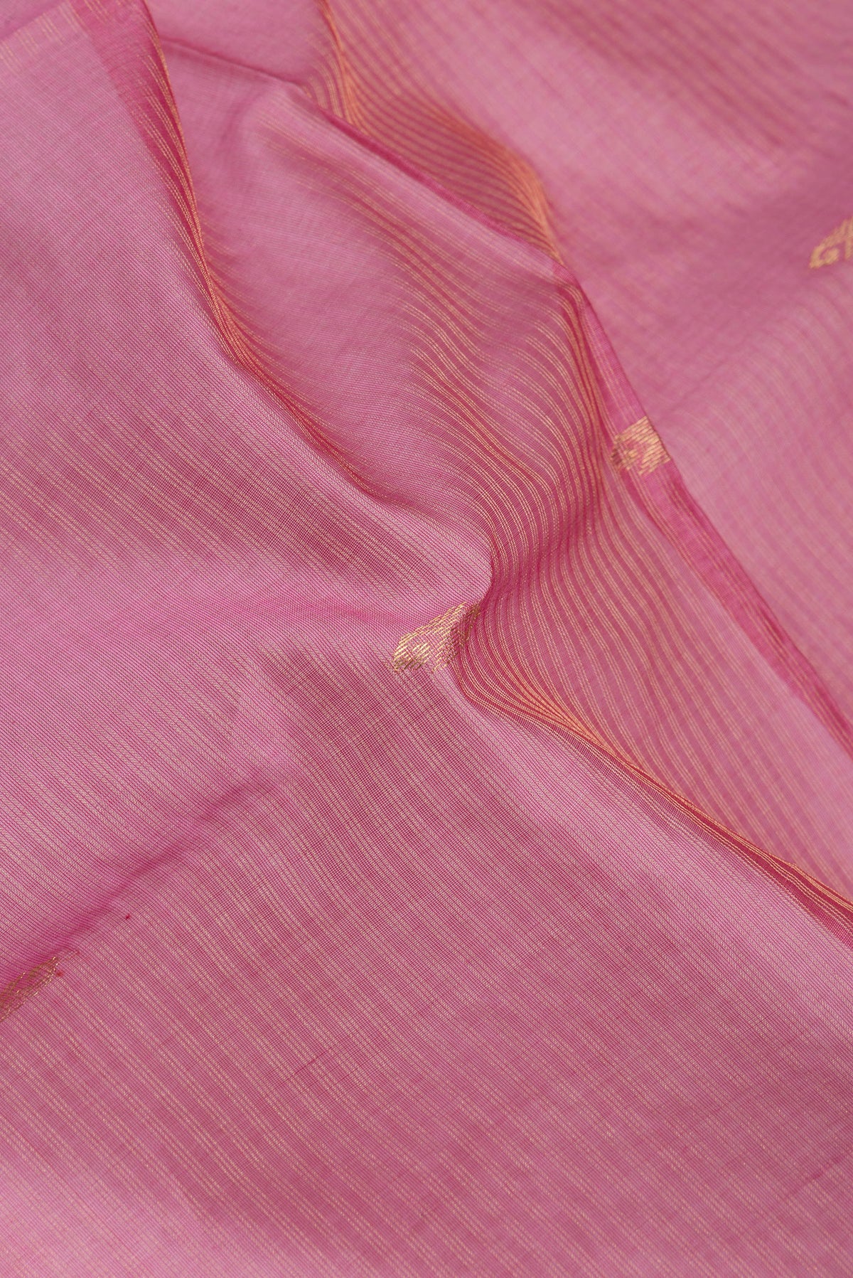 Close up of Pink Dual Tone Maheshwari Silk Saree with Stripes on the body and Zari Border.  displaying folds