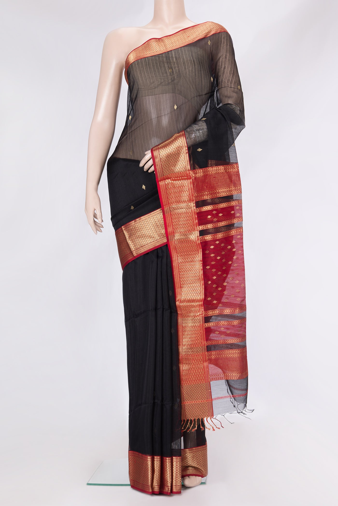 Black Dual Tone Maheshwari Silk Saree with Zari Butta on the body and Zari Border.  displayed on a mannequin