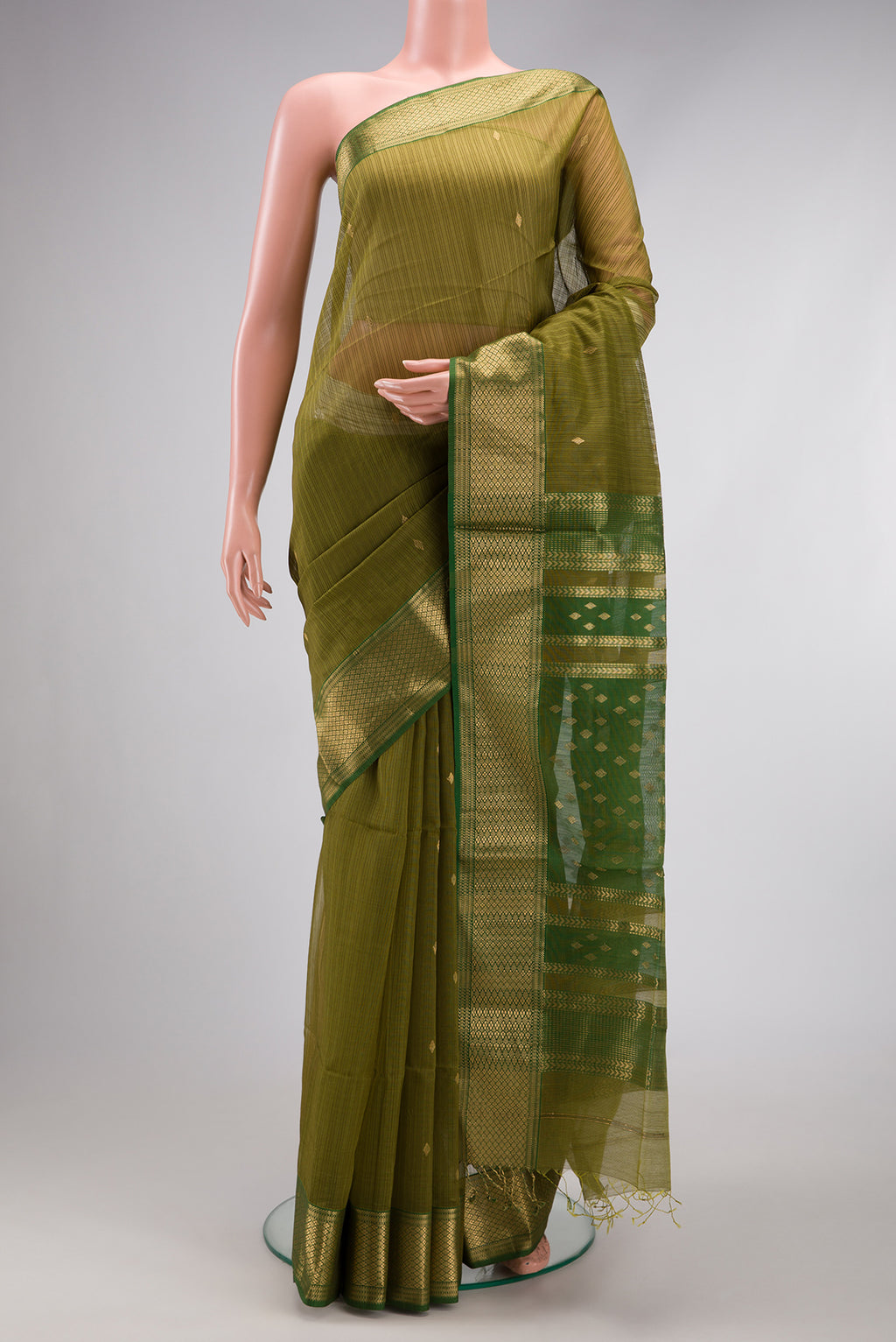 Green Dual Tone Maheshwari Silk Cotton Saree with Zari Butta on the body and Zari Border.  displayed on a mannequin