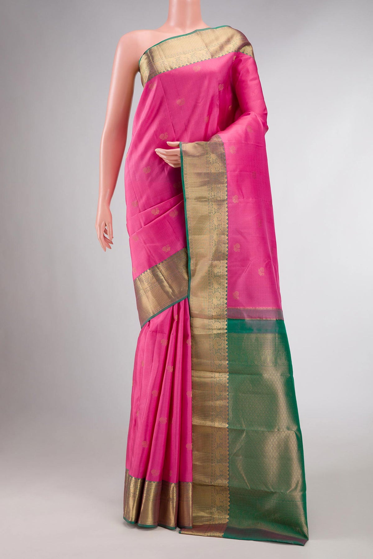 Pink Dual Tone Kanchipuram Silk Saree with Zari Butta on the body and Zari Border displayed on a mannequin