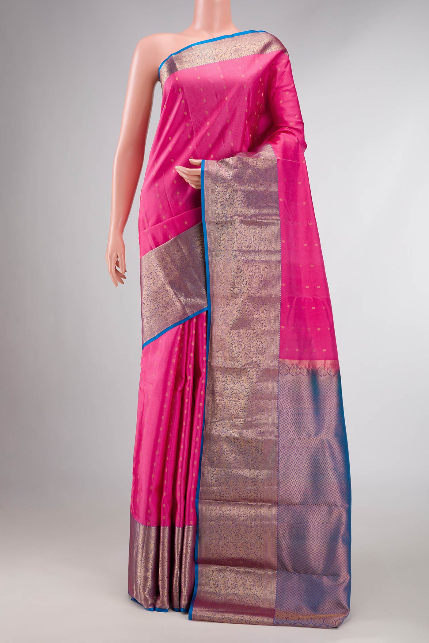 Pink Dual Tone Kanchipuram Silk Saree with Zari Butta on the body and Zari Border displayed on a mannequin
