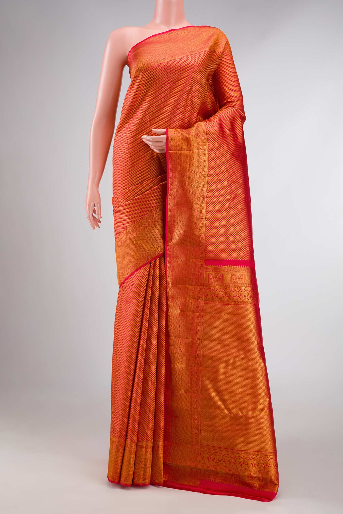 Red Dual Tone Kanchipuram Silk Saree with Zari Brocade on the body and Zari Border displayed on a mannequin