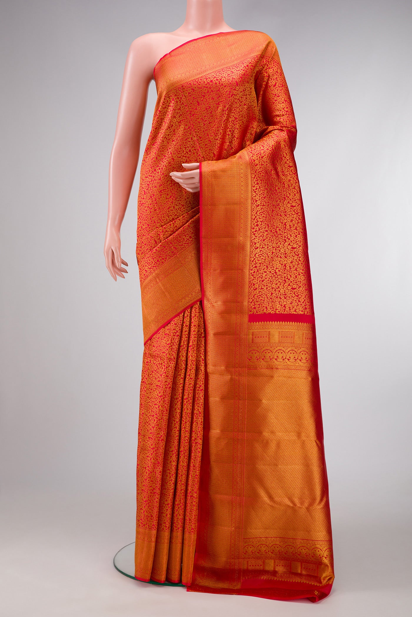 Red Dual Tone Kanchipuram Silk Saree with Zari Brocade on the body and Fancy Border.  displayed on a mannequin