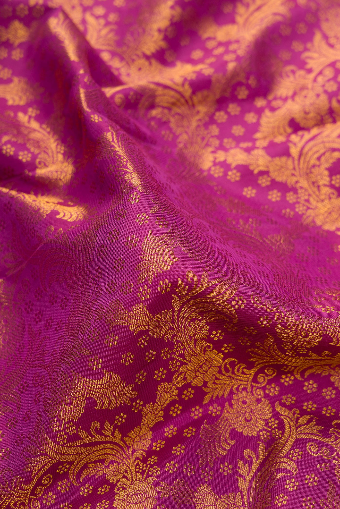 Close up of Purple Dual Tone Kanchipuram Silk Saree with Zari Brocade on the body and Zari Border.  displaying folds