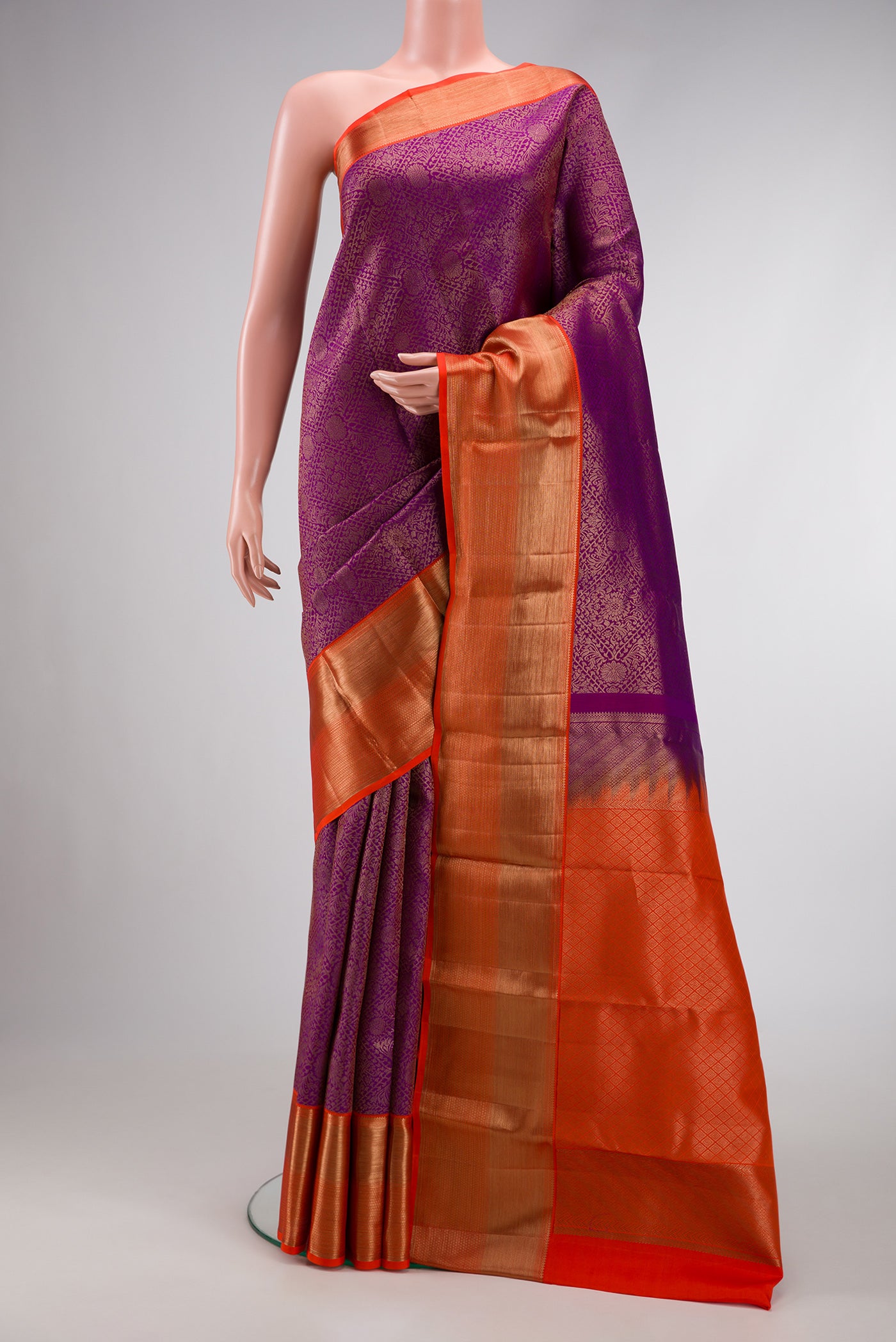 Purple Dual Tone Kanchipuram Silk Saree with Zari Brocade on the body and Zari Border.  displayed on a mannequin