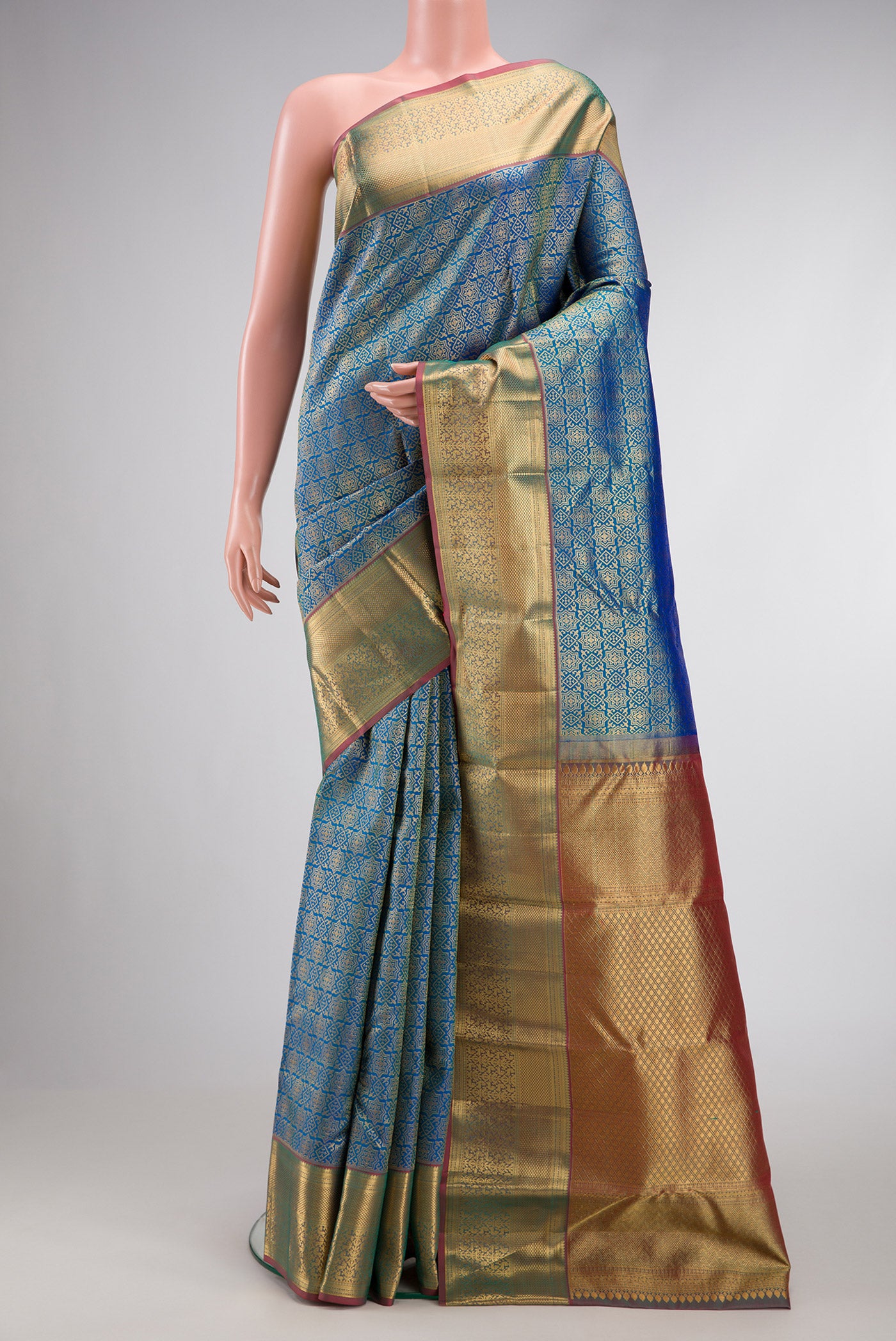 Peacock Blue Dual Tone Kanchipuram Silk Saree with Zari Brocade on the body and Zari Border.  displayed on a mannequin