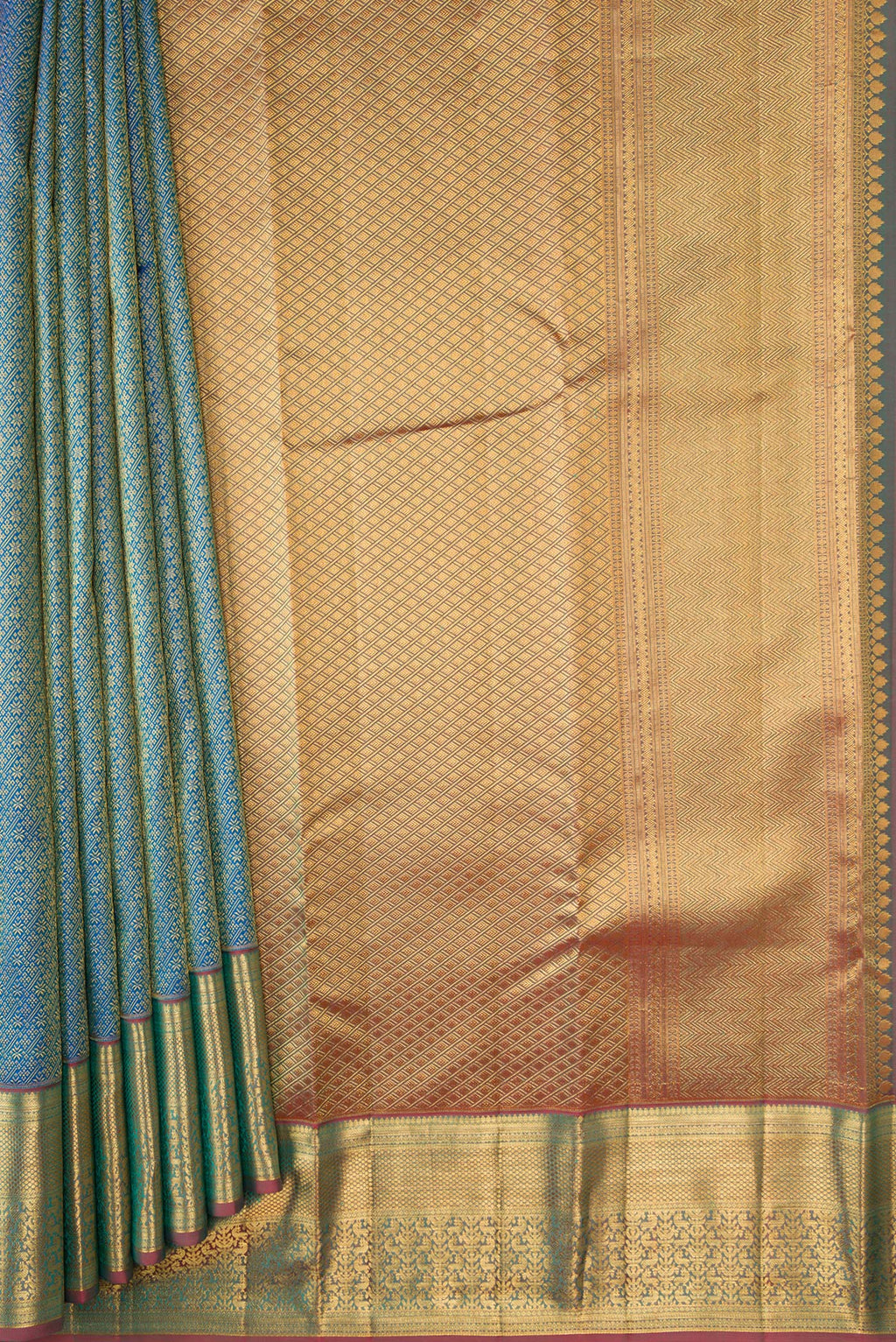 Pleats and pallu of Peacock Blue Dual Tone Kanchipuram Silk Saree with Zari Brocade on the body and Zari Border. 