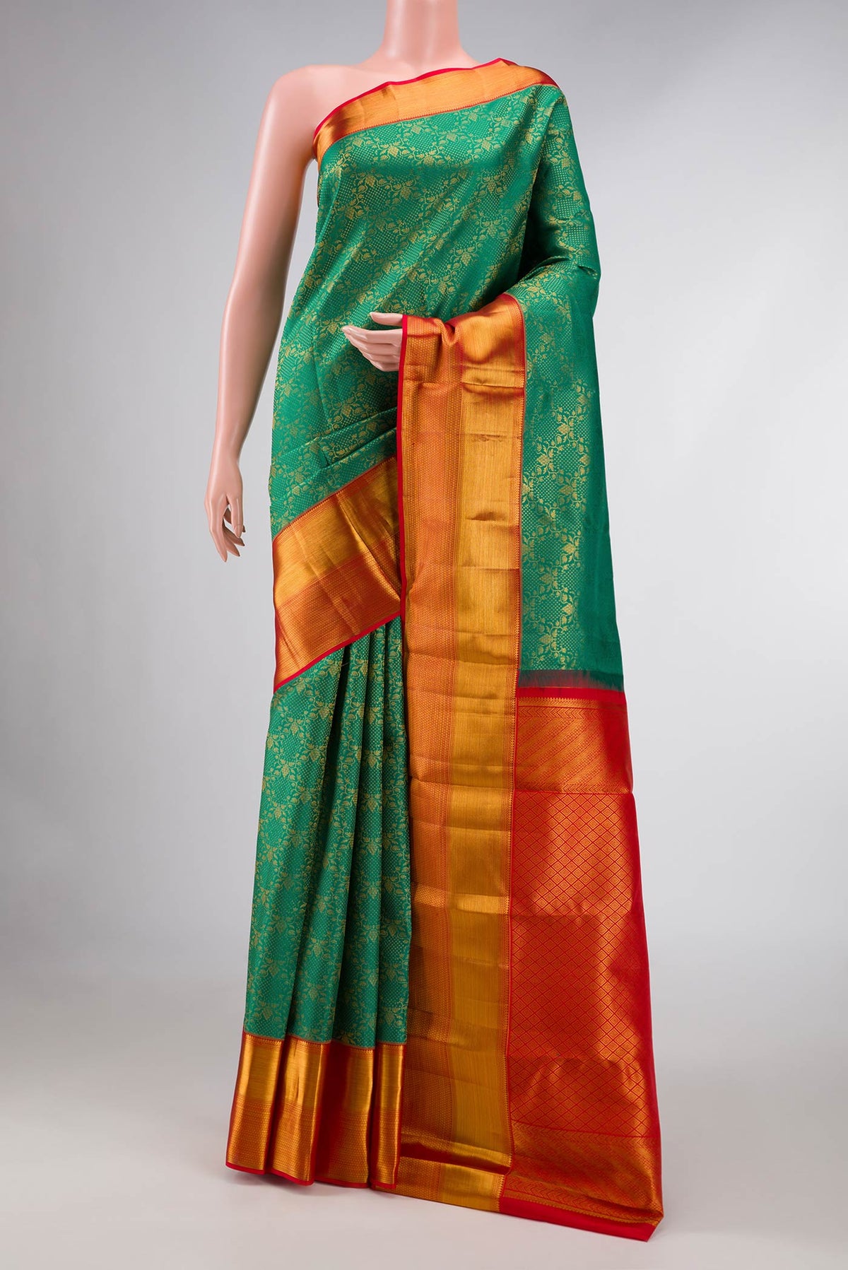 Green Dual Tone Kanchipuram Silk Saree with Zari Brocade on the body and Zari Border displayed on a mannequin