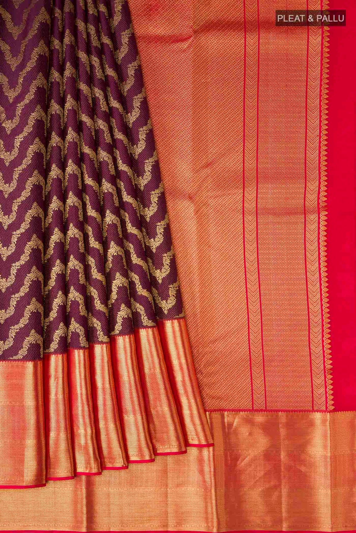 Pleats and pallu of Burgundy Kanchipuram Silk Saree with Zari Brocade on the body and Zari Border
