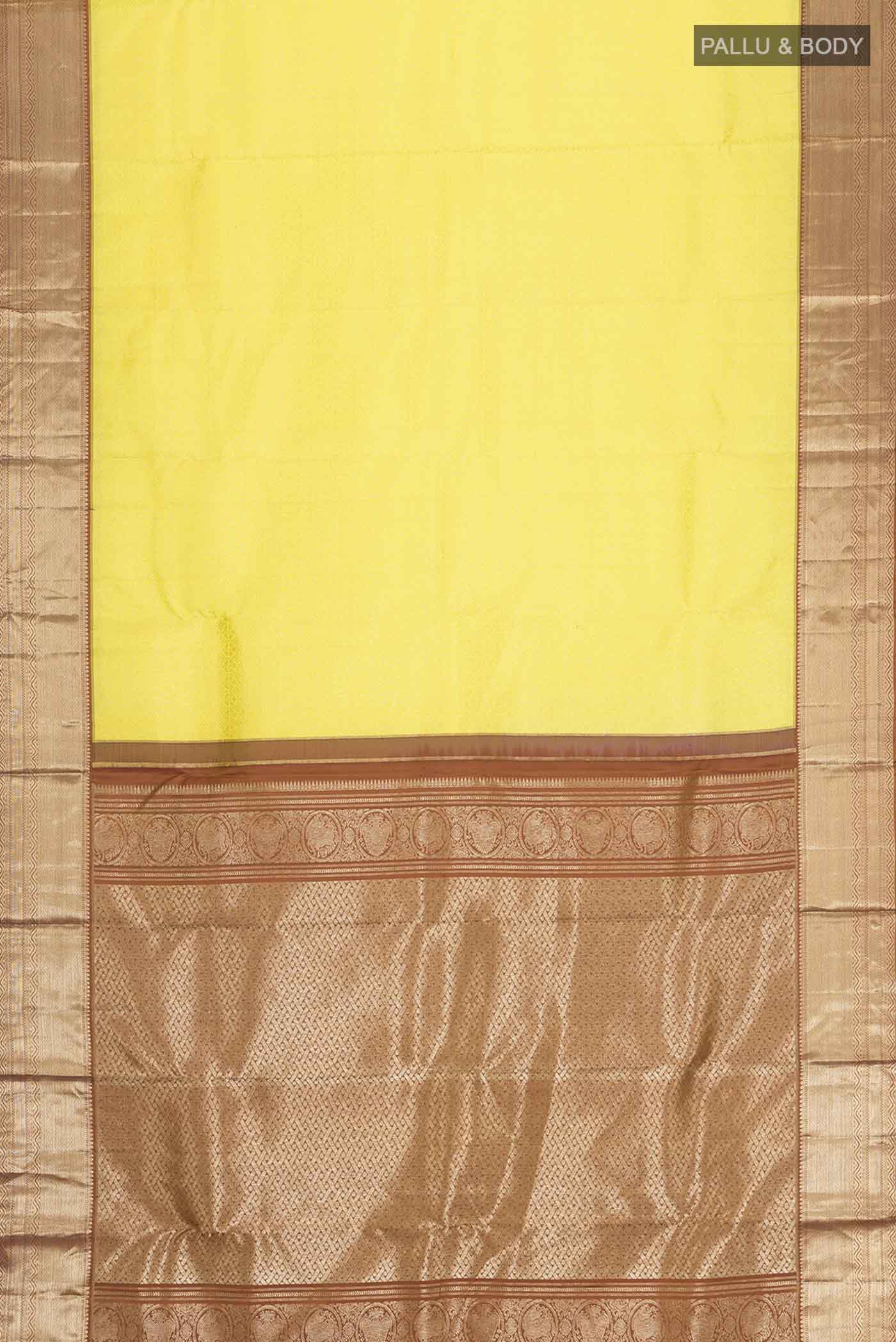 Flat view of Yellow Kanchipuram Silk Saree with Zari Brocade on the body and Zari Border