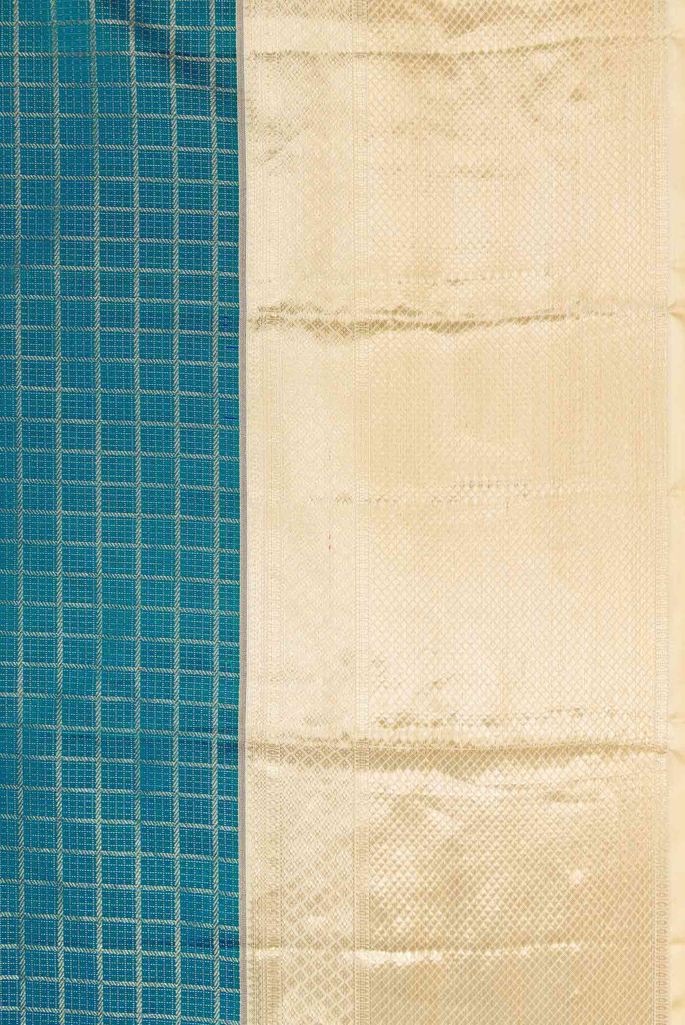 Border image of Peacock Blue Dual Tone Kanchipuram Silk Saree with Zari Brocade on the body and Zari Border. 