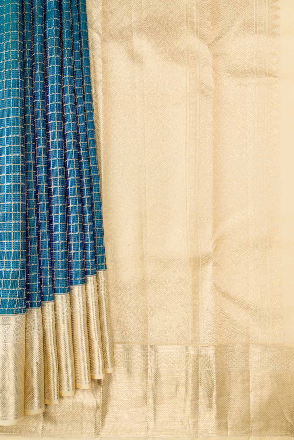 Pleats and pallu of Peacock Blue Dual Tone Kanchipuram Silk Saree with Zari Brocade on the body and Zari Border. 