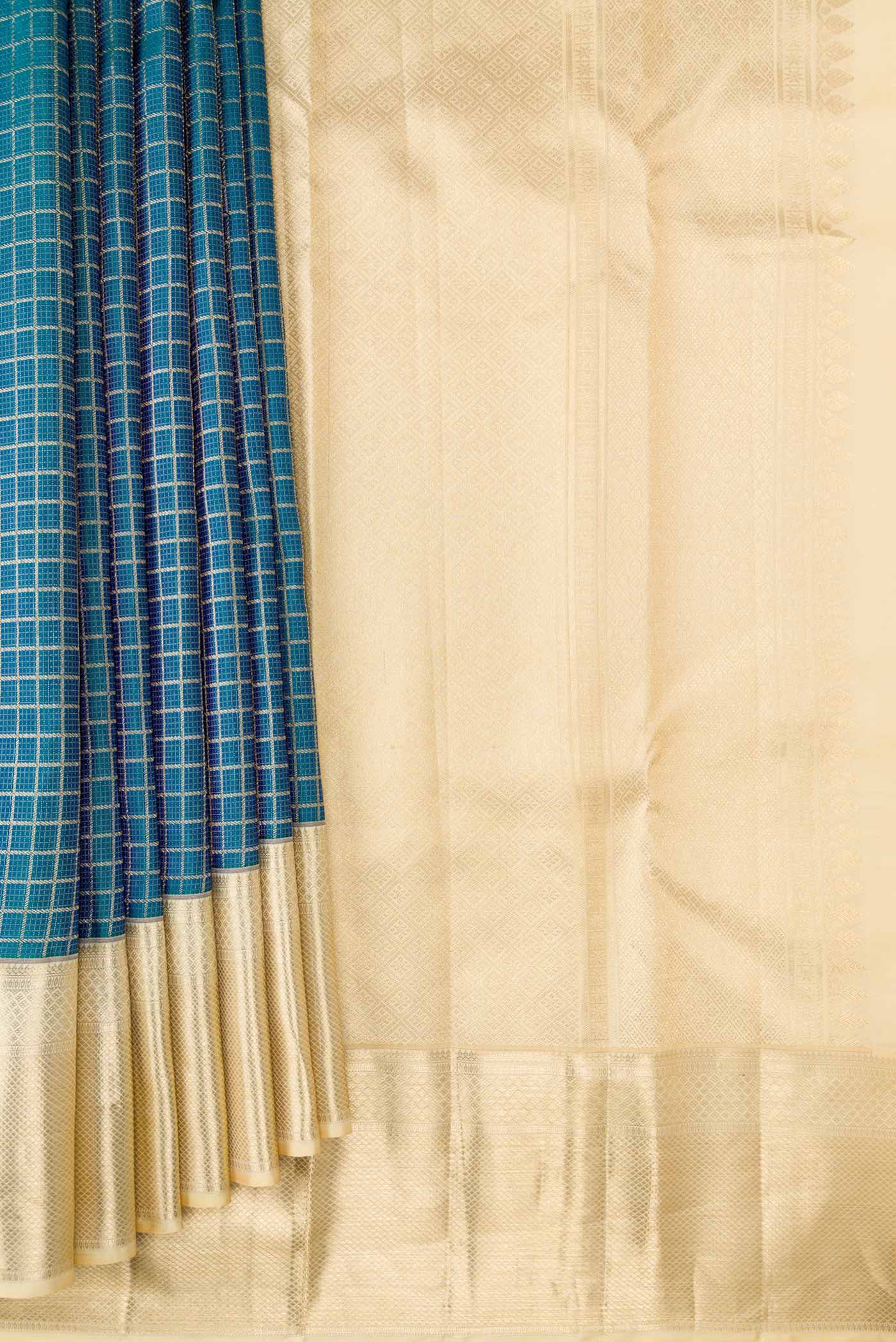 Pleats and pallu of Peacock Blue Dual Tone Kanchipuram Silk Saree with Zari Brocade on the body and Zari Border. 