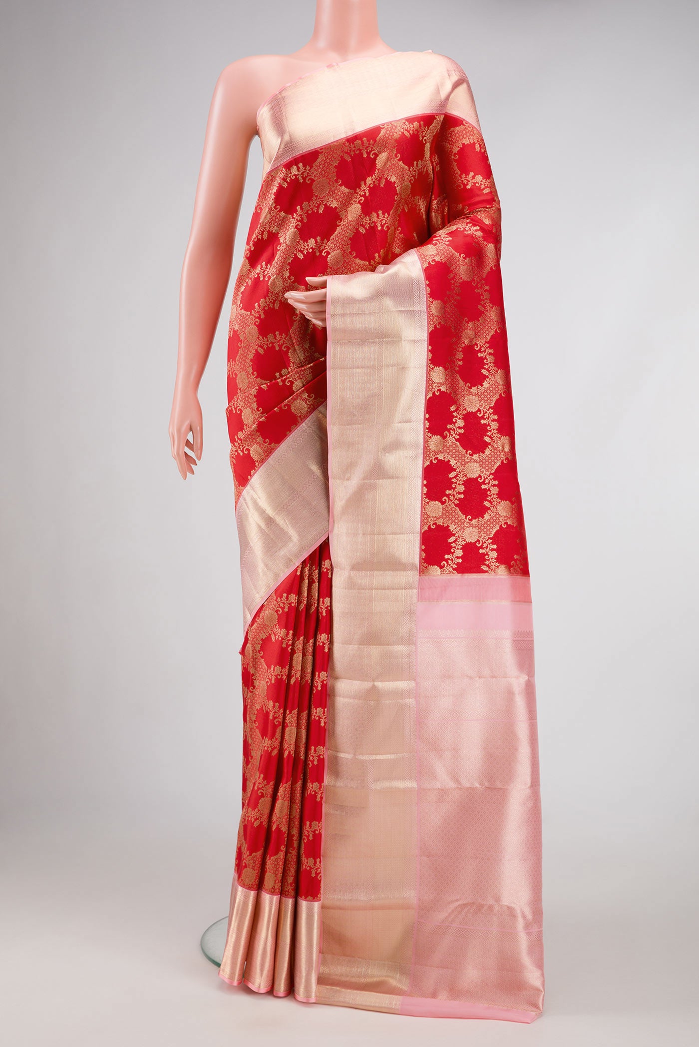 Red Dual Tone Kanchipuram Silk Saree with Zari Brocade on the body and Zari Border.  displayed on a mannequin