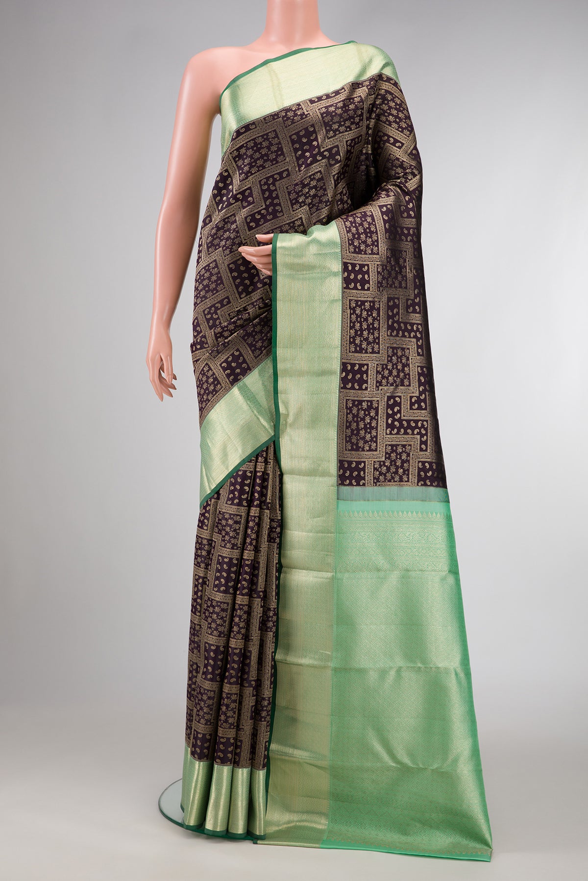 Coffee Brown Dual Tone Kanchipuram Silk Saree with Zari Brocade on the body and Zari Border.  displayed on a mannequin