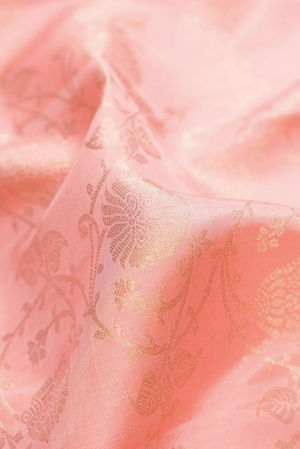 Close up of Pink Dual Tone Kanchipuram Silk Saree with Zari Brocade on the body and Zari Border.  displaying folds