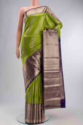 Green Kanchipuram Silk Saree with Zari Butta on the body and Zari Border displayed on a mannequin
