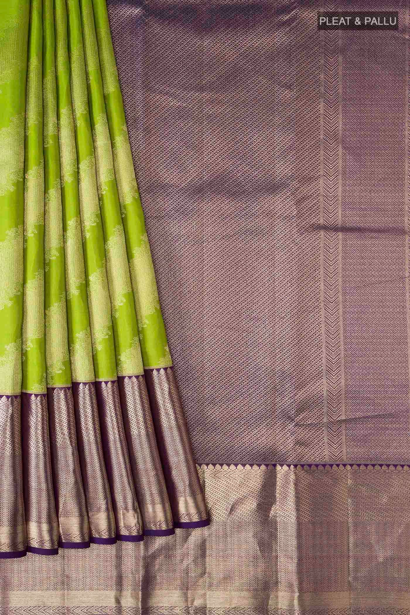 Pleats and pallu of Green Kanchipuram Silk Saree with Zari Butta on the body and Zari Border