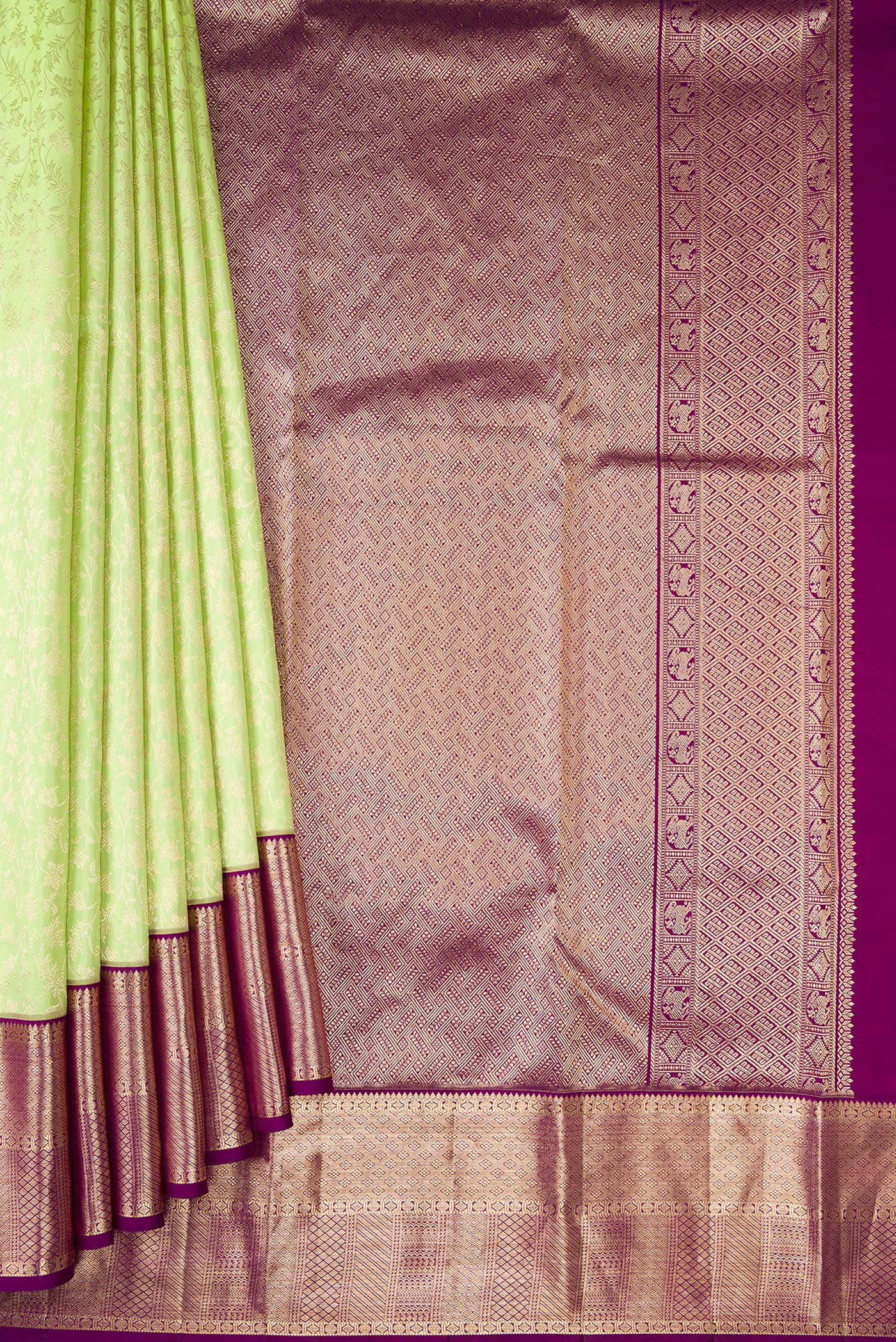 Pleats and pallu of Parrot Green Dual Tone Kanchipuram Silk Saree with Zari Brocade on the body and Zari Border. 