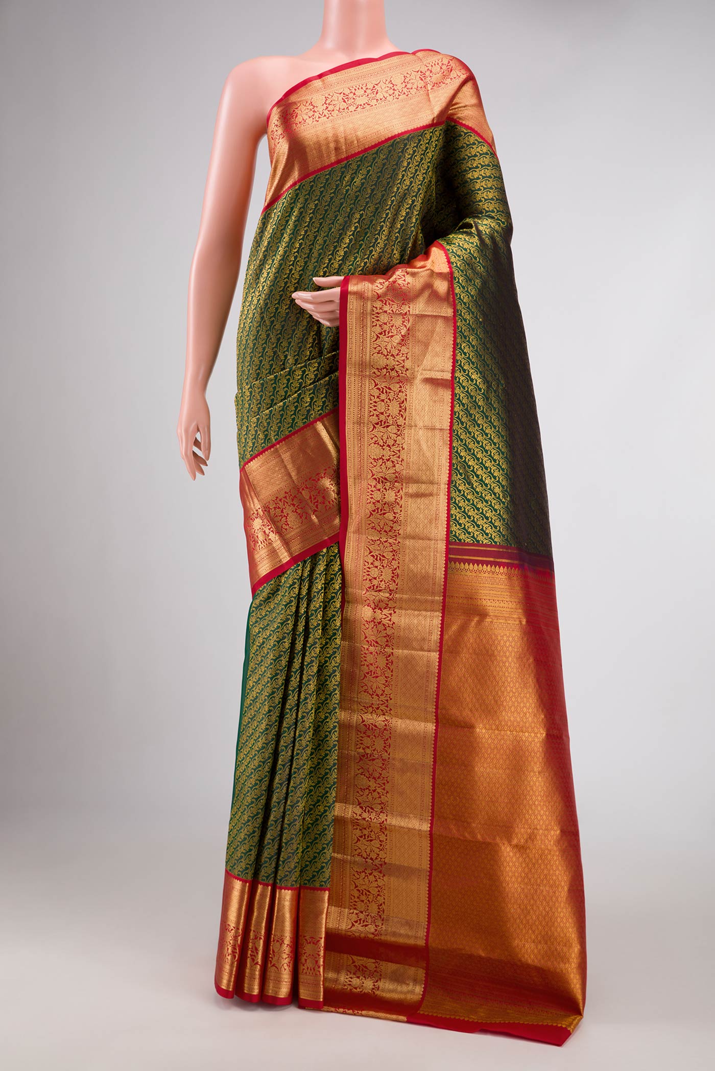 Bottle Green Dual Tone Kanchipuram Silk Saree with Zari Brocade on the body and Zari Border.  displayed on a mannequin