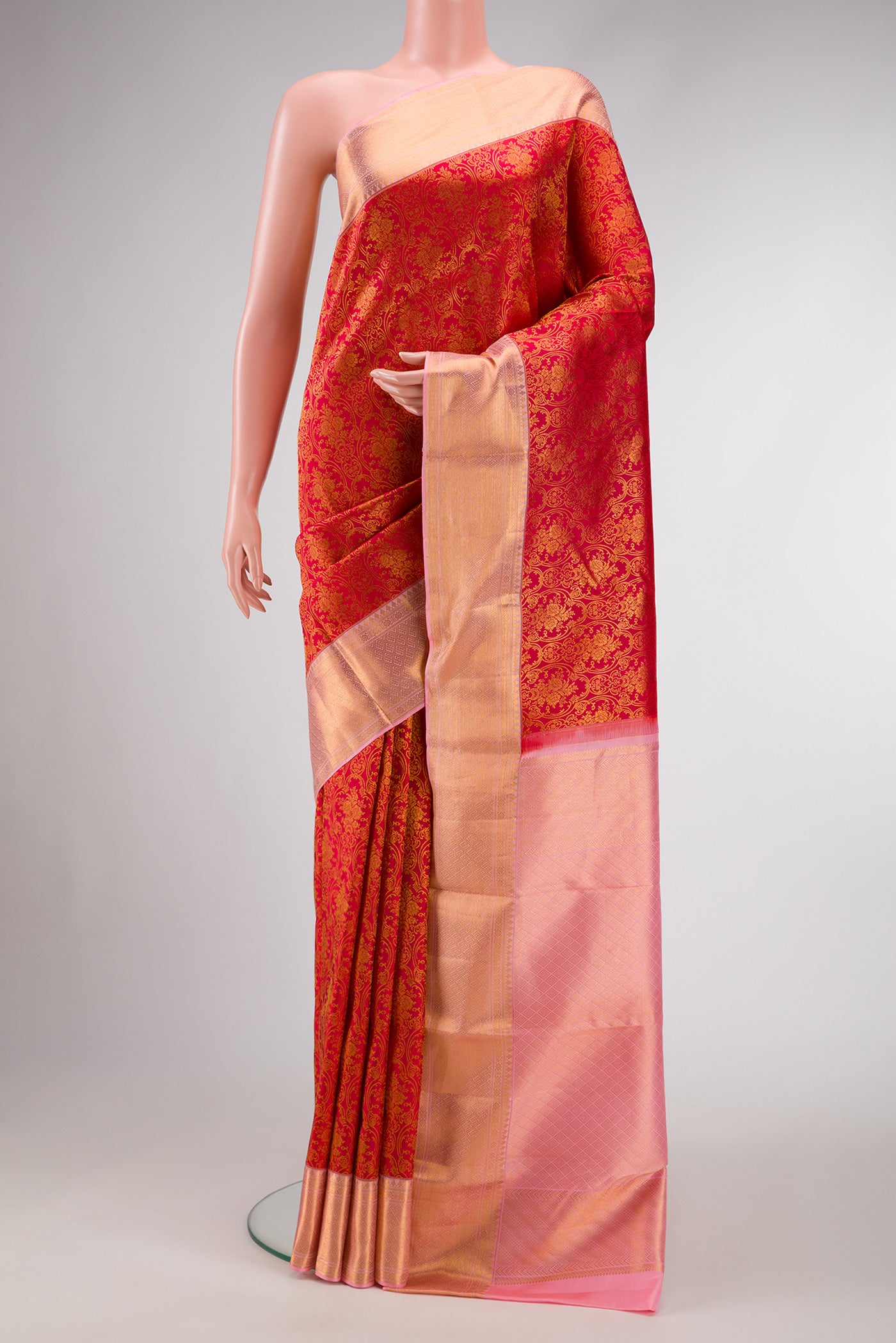 Red Dual Tone Kanchipuram Silk Saree with Zari Brocade on the body and Zari Border.  displayed on a mannequin