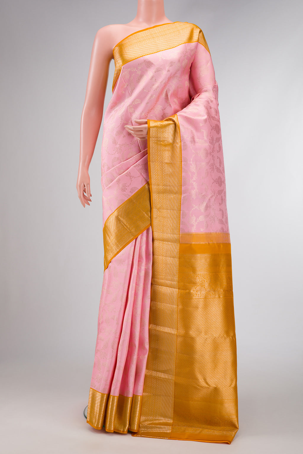 Pink Dual Tone Kanjivaram Silk Saree with Zari Brocade on the body and Zari Border.  displayed on a mannequin