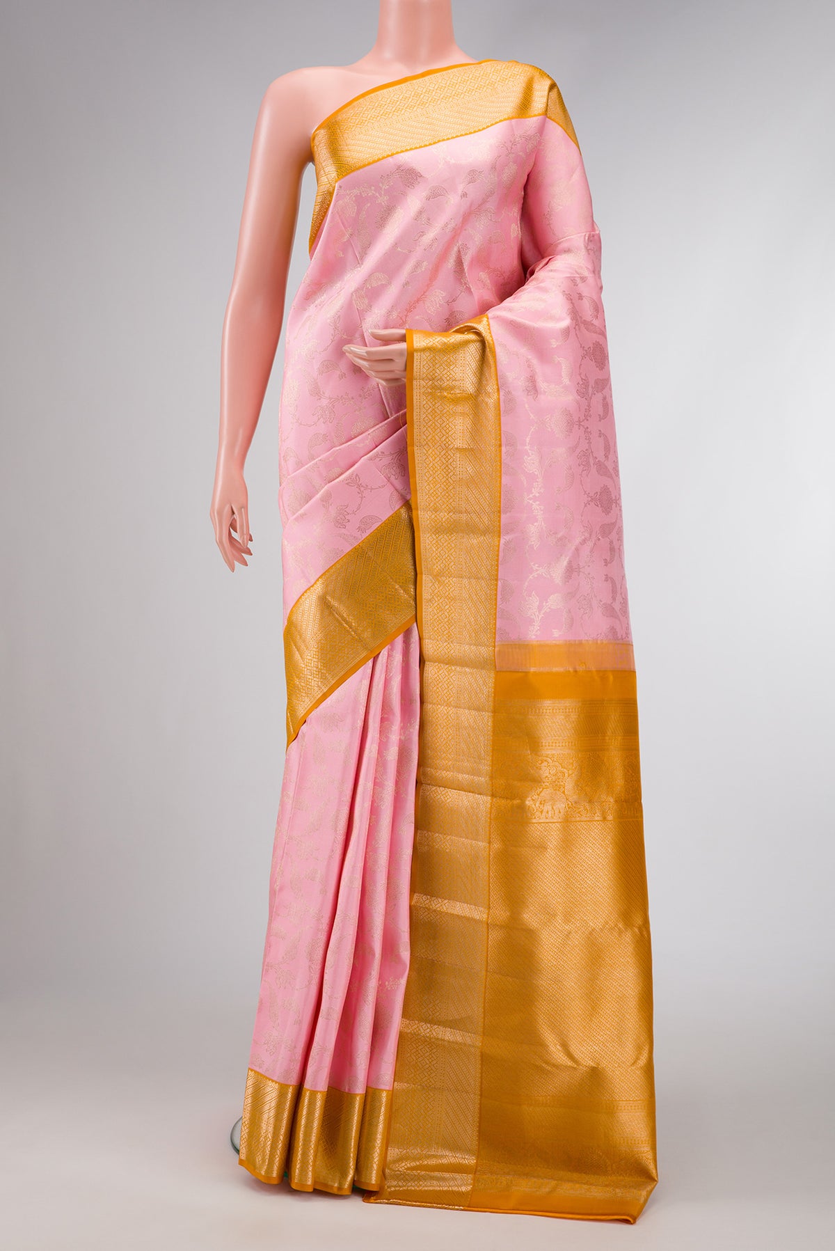 Pink Dual Tone Kanjivaram Silk Saree with Zari Brocade on the body and Zari Border.  displayed on a mannequin