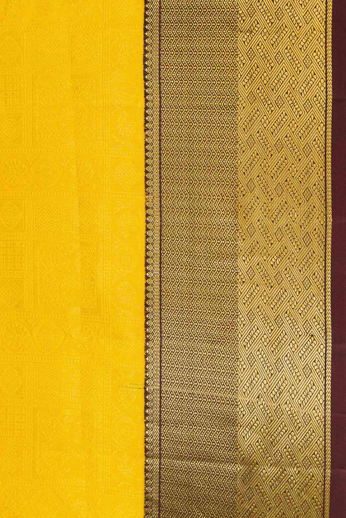 Border image of Yellow Dual Tone Kanjivaram Silk Saree with Zari Brocade on the body and Zari Border. 