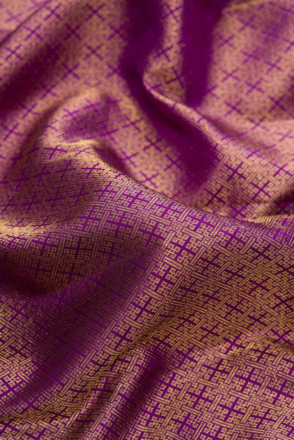 Close up of Purple Dual Tone Kanjivaram Silk Saree with Zari Brocade on the body and Zari Border.  displaying folds