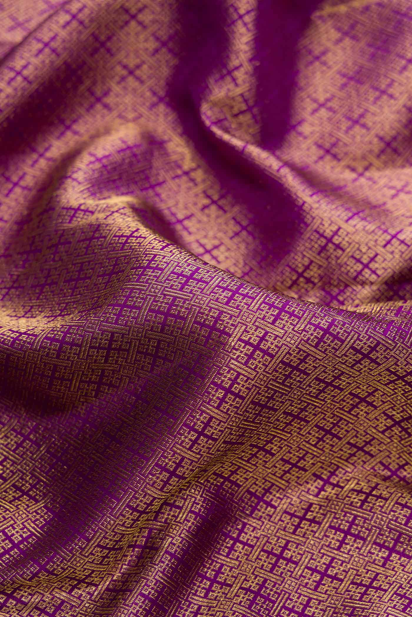 Close up of Purple Dual Tone Kanjivaram Silk Saree with Zari Brocade on the body and Zari Border.  displaying folds