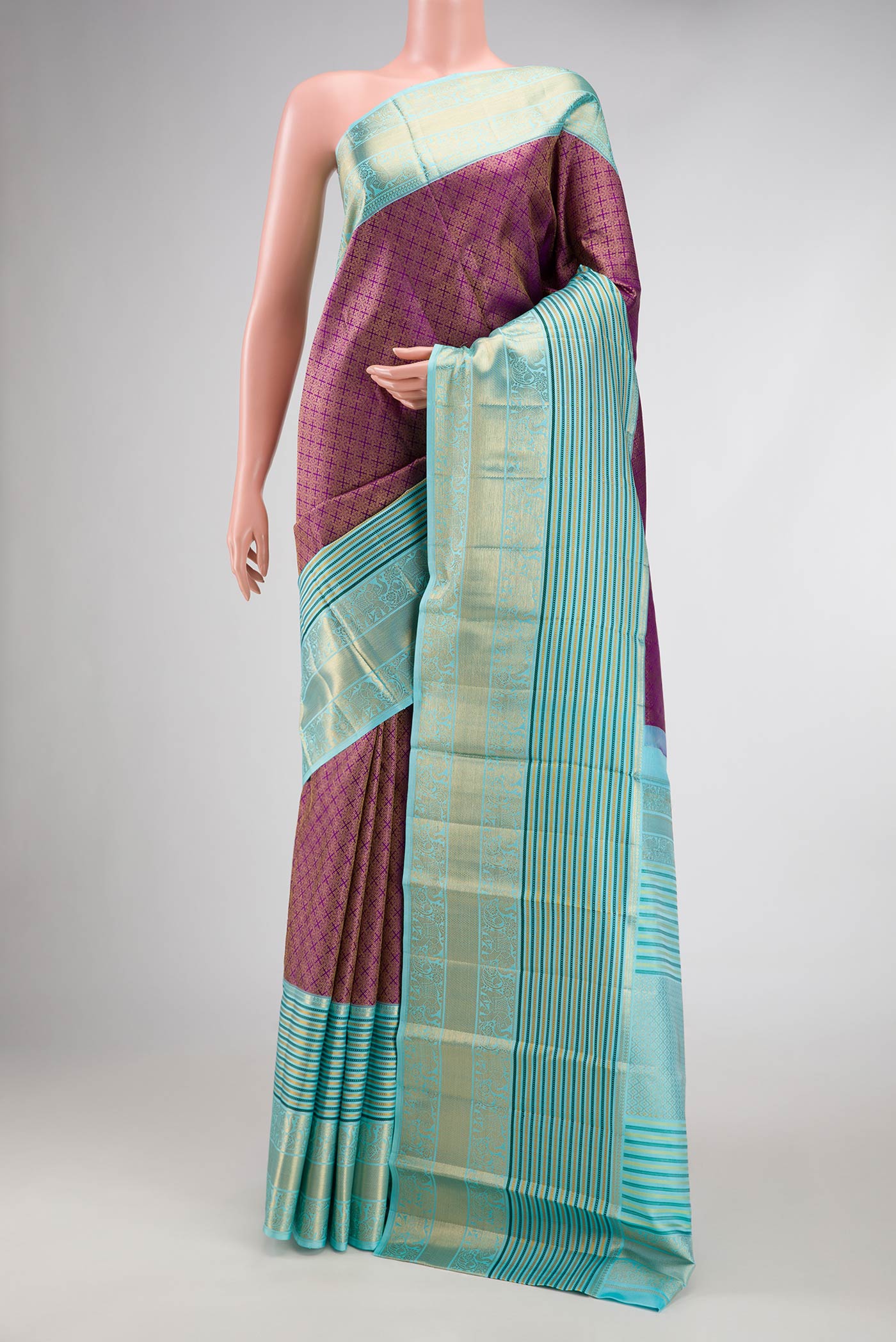 Purple Dual Tone Kanjivaram Silk Saree with Zari Brocade on the body and Zari Border.  displayed on a mannequin