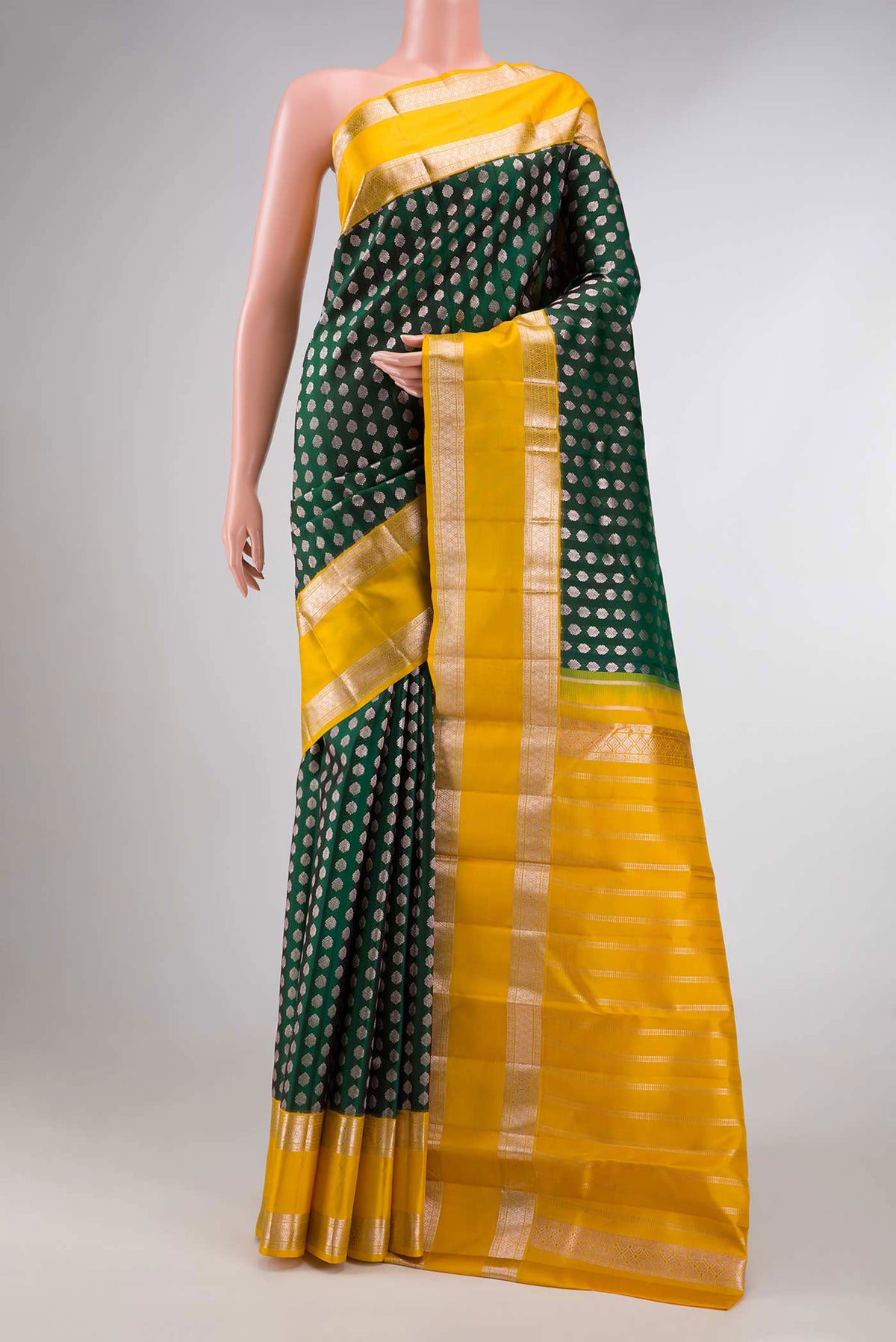 Green Dual Tone Kanchipuram Silk Saree with Zari Brocade on the body and Zari Border displayed on a mannequin