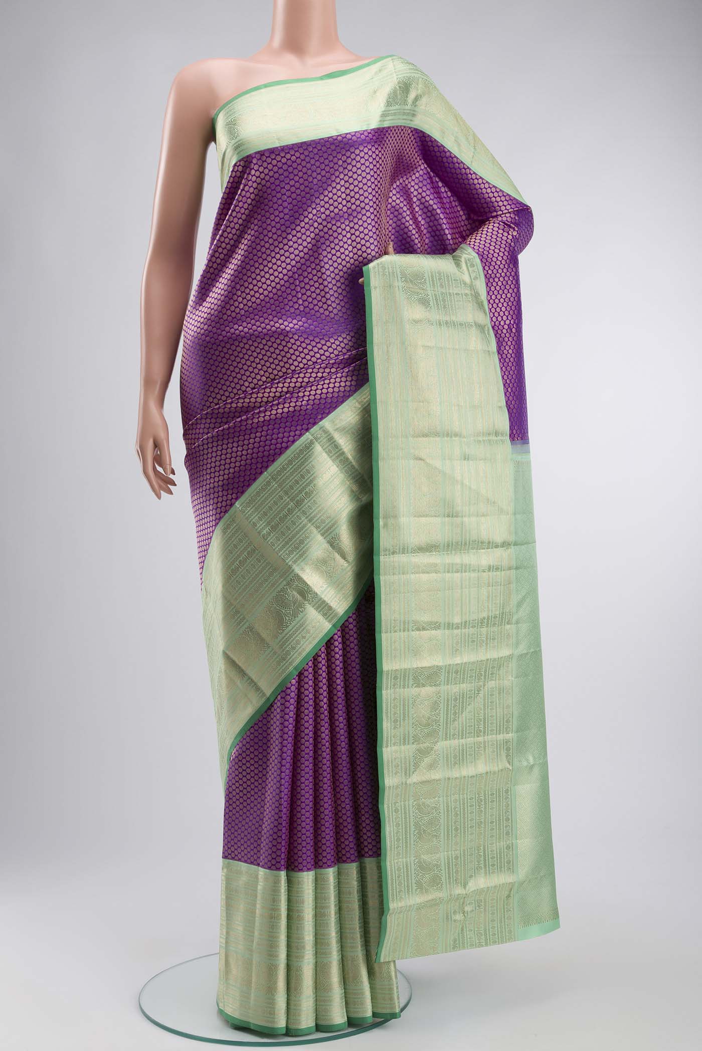 Violet Kanchipuram Silk Saree with Zari Brocade on the body and Zari Border displayed on a mannequin