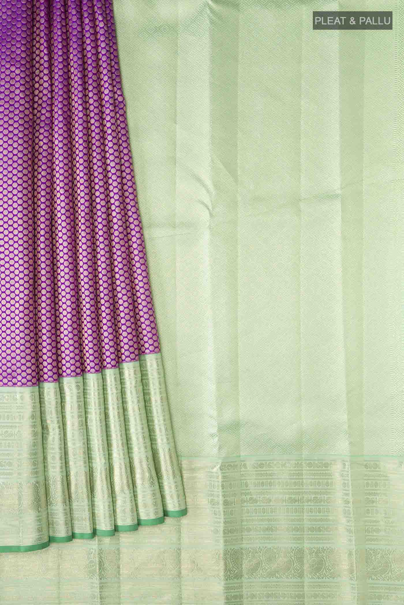 Pleats and pallu of Violet Kanchipuram Silk Saree with Zari Brocade on the body and Zari Border
