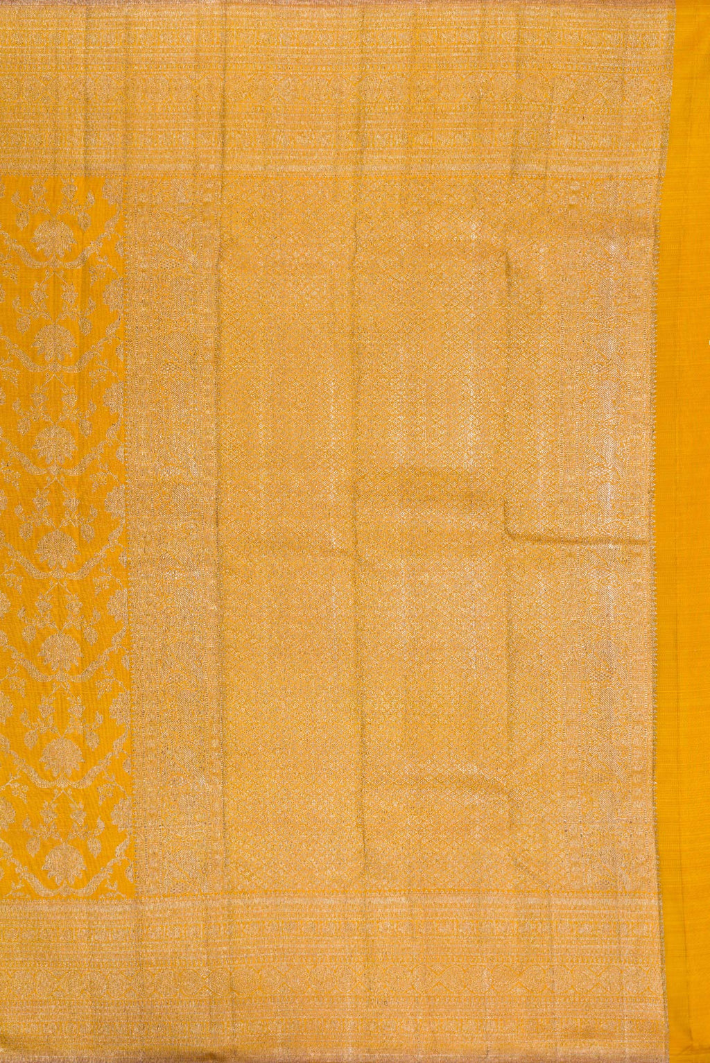 Close up image of the pallu of Pure Silk Mustard Kanchipuram Saree with Zari Brocade on the body and Zari Border. 
