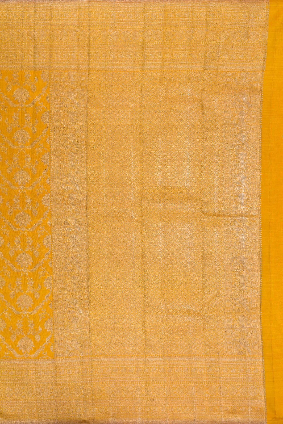 Close up image of the pallu of Pure Silk Mustard Kanchipuram Saree with Zari Brocade on the body and Zari Border. 