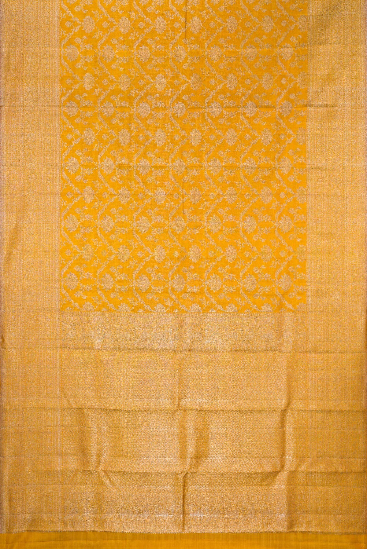 Flat view of Pure Silk Mustard Kanchipuram Saree with Zari Brocade on the body and Zari Border. 