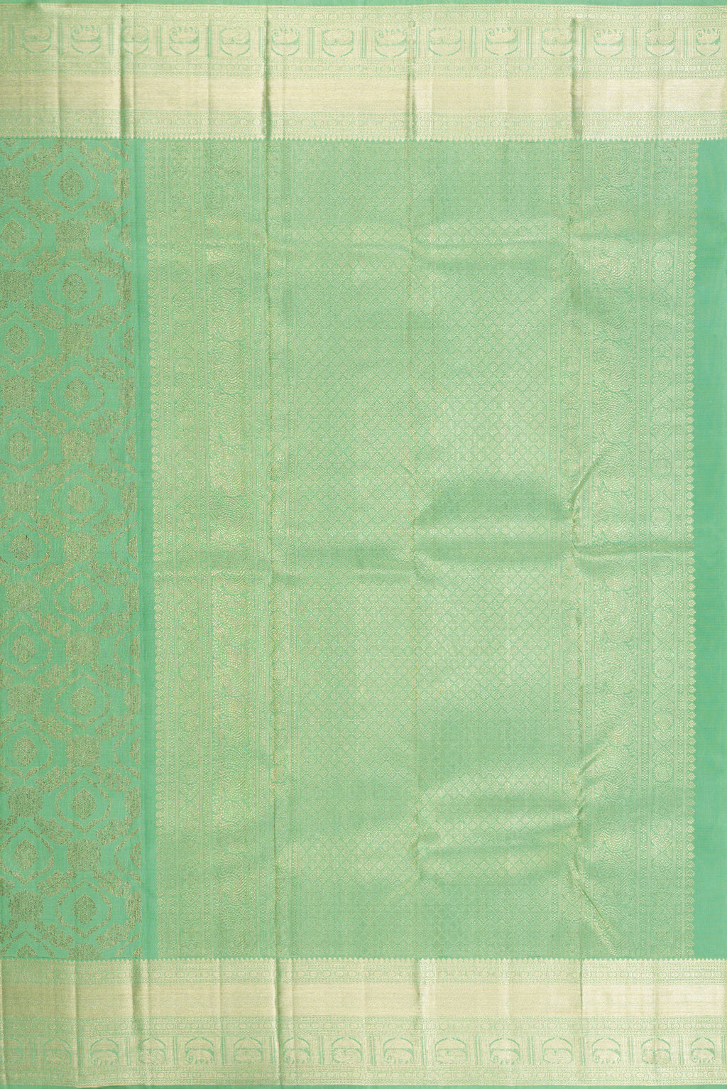 Close up image of the pallu of Green Dual Tone Kanchipuram Silk Saree with Zari Brocade on the body and Zari Border. 