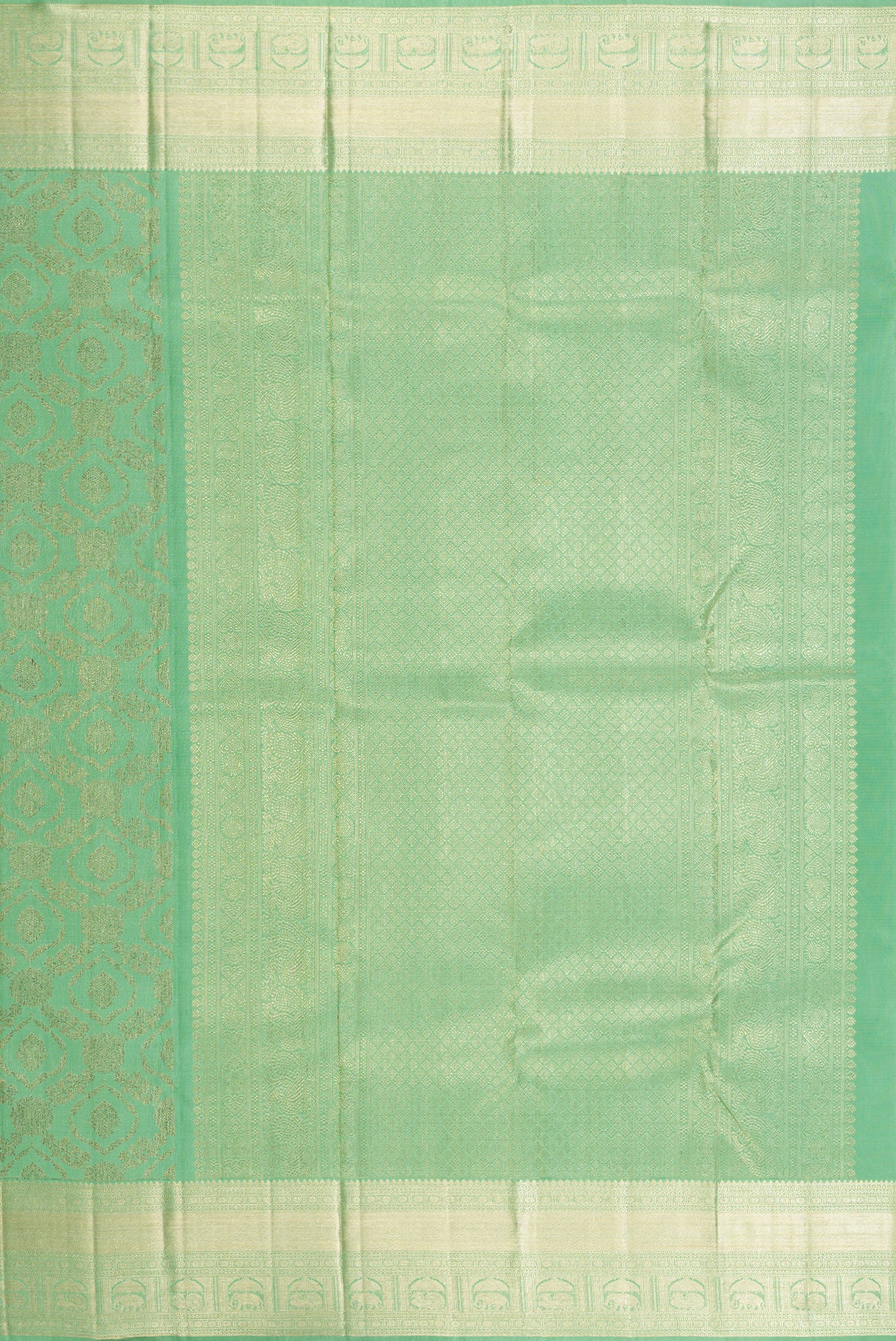 Close up image of the pallu of Green Dual Tone Kanchipuram Silk Saree with Zari Brocade on the body and Zari Border. 