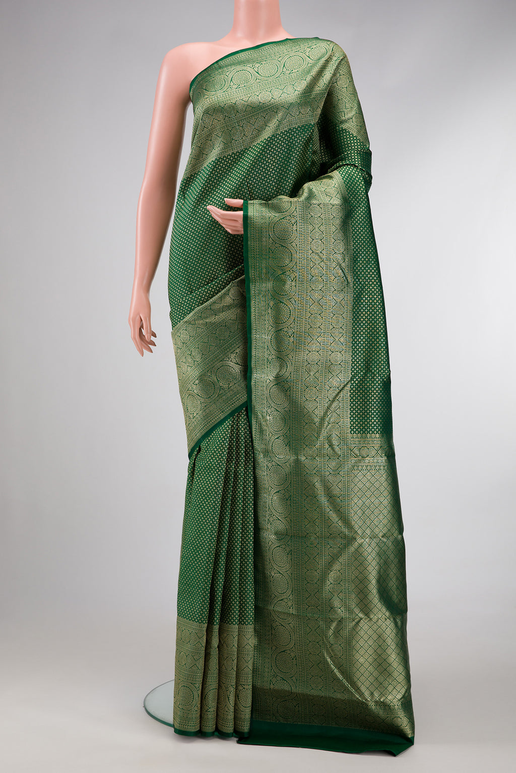 Bottle Green Dual Tone Kanchipuram Silk Saree with Zari Brocade on the body and Fancy Border.  displayed on a mannequin