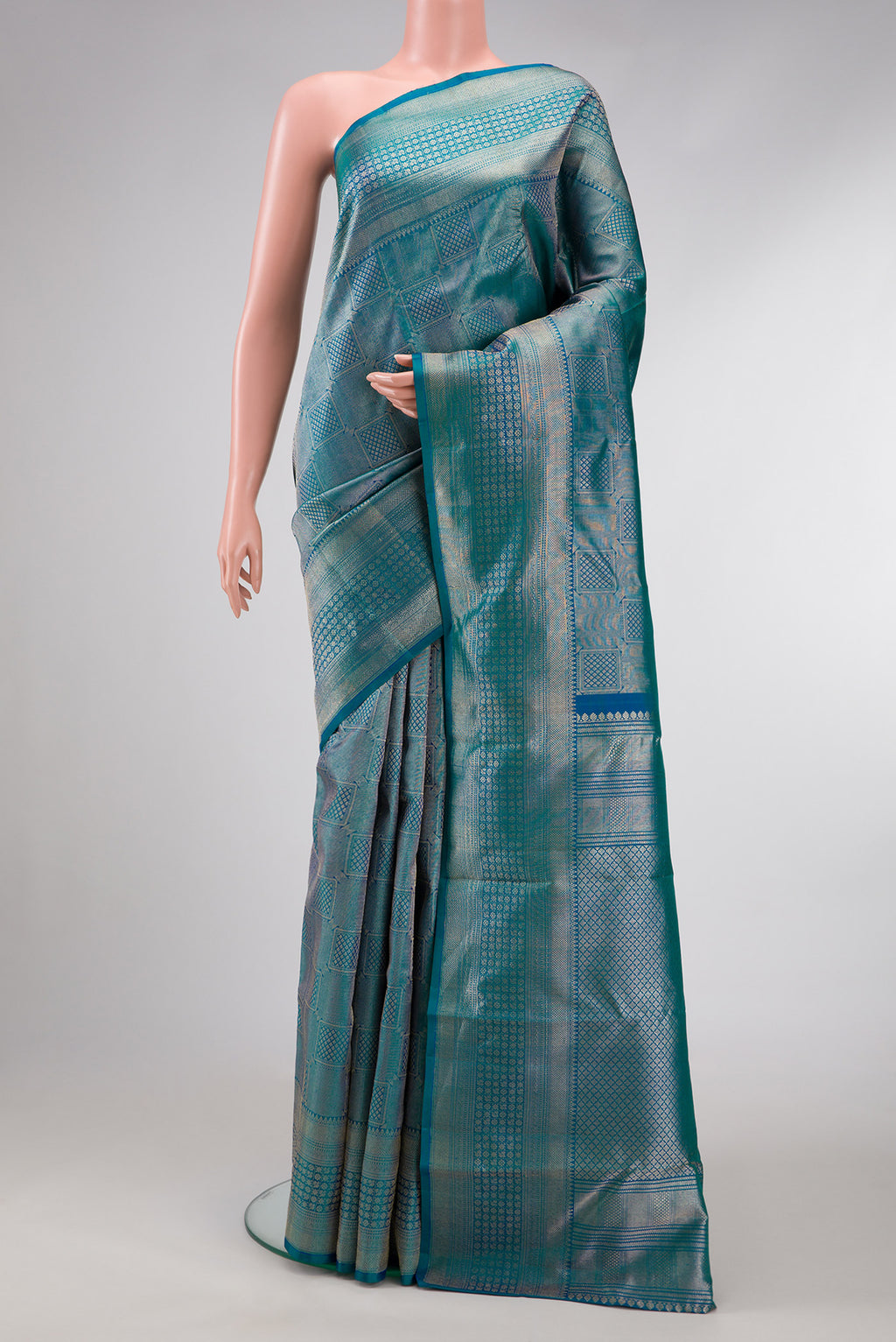 Peacock Blue Dual Tone Kanchipuram Silk Saree with Zari Brocade on the body and Zari Border.  displayed on a mannequin