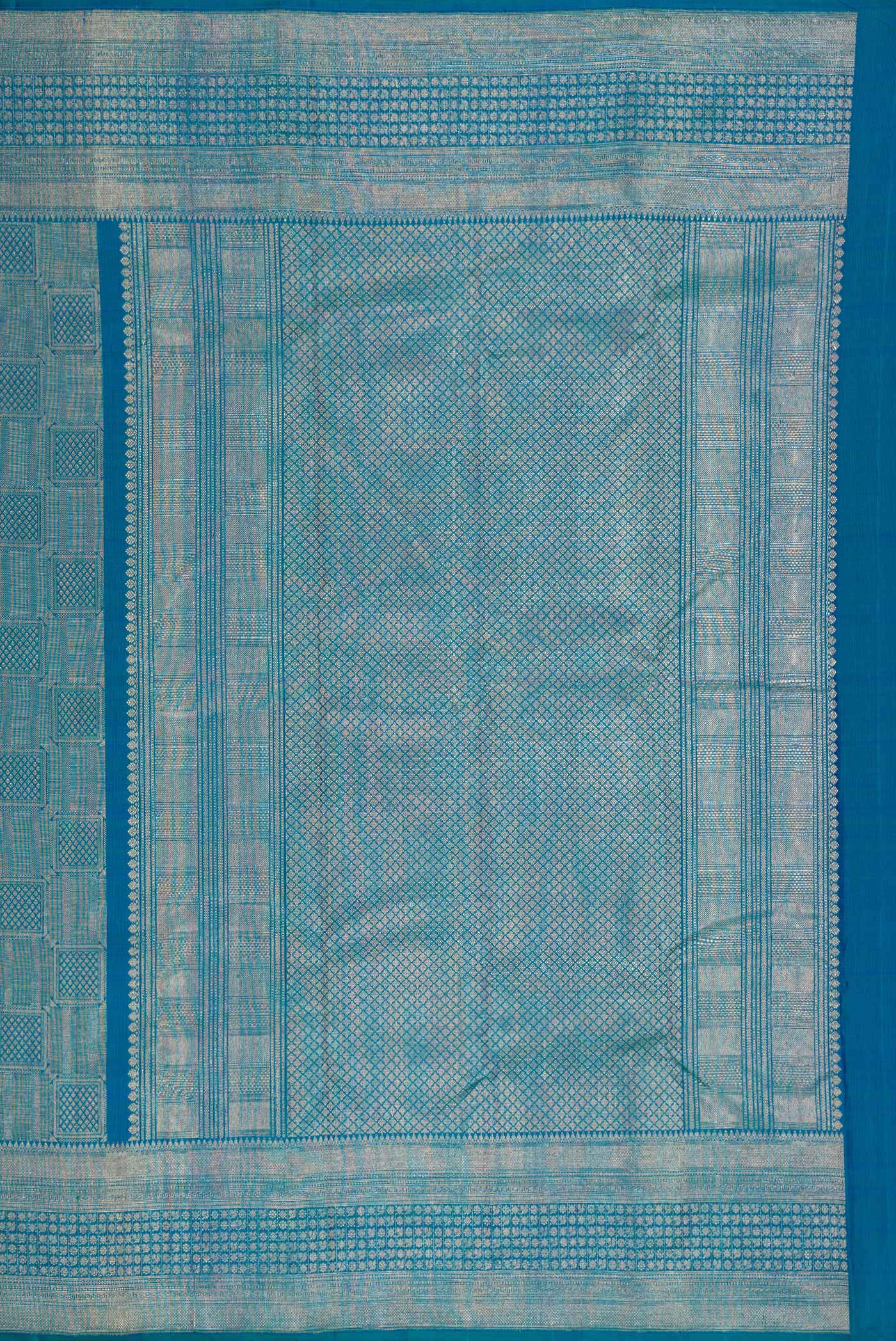 Close up image of the pallu of Peacock Blue Dual Tone Kanchipuram Silk Saree with Zari Brocade on the body and Zari Border. 