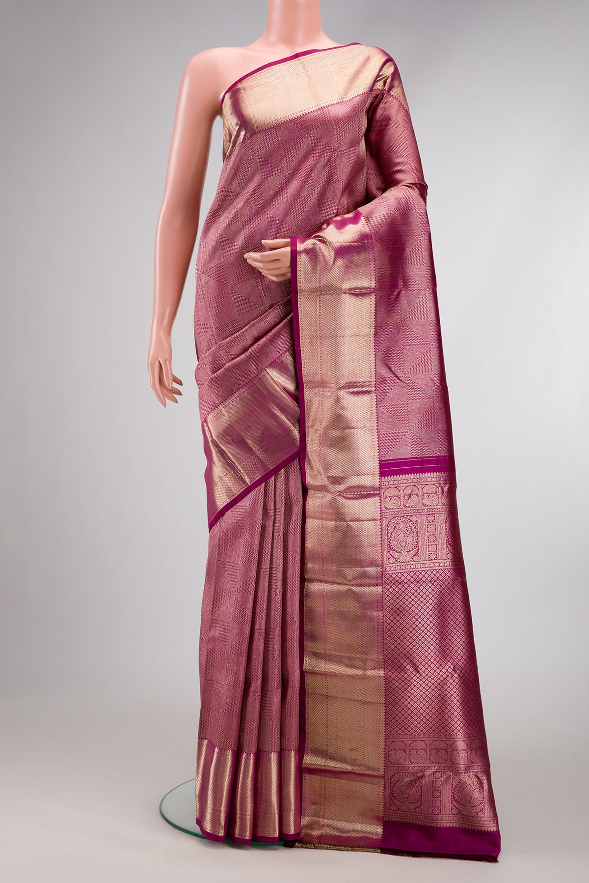 Magenta Dual Tone Kanchipuram Silk Saree with Zari Brocade on the body and Zari Border.  displayed on a mannequin