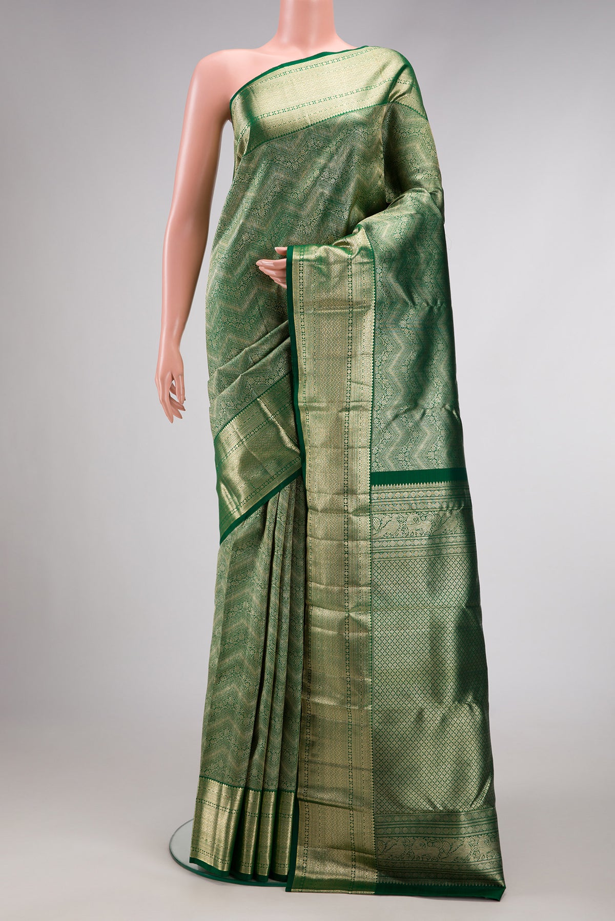 Bottle Green Dual Tone Kanchipuram Silk Saree with Zari Brocade on the body and Zari Border.  displayed on a mannequin